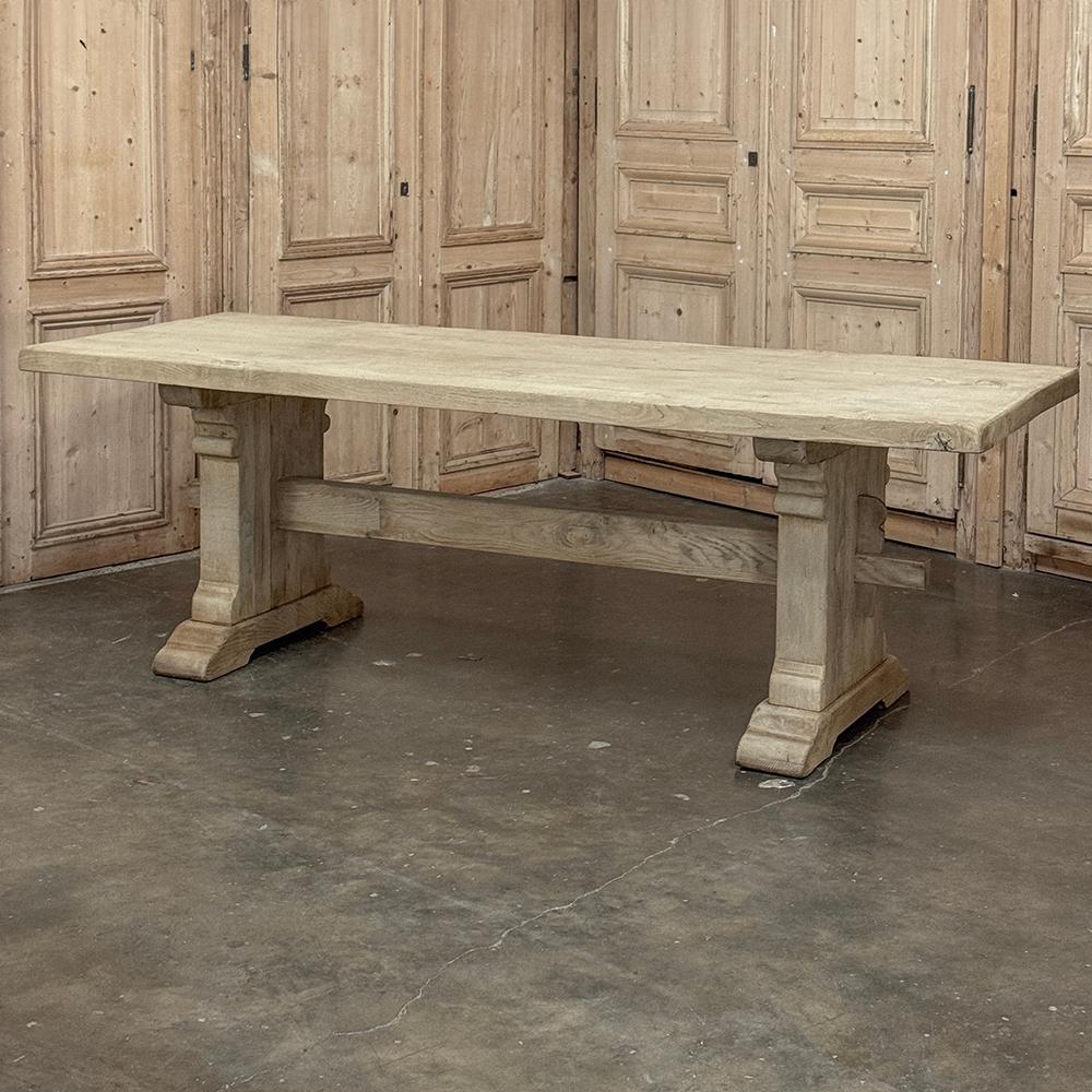 Rustic European Stripped Oak Trestle Dining Table takes sturdy to another level!  Hand-crafted in the traditional style from thick planks of densely grained oak, its top is so thick and solid a supporting apron is unnecessary, leaving maximum knee