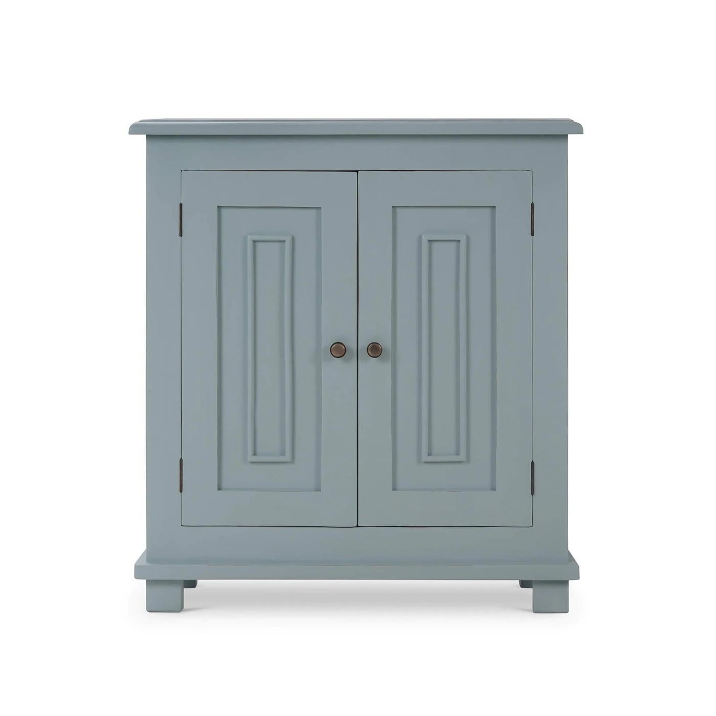 Crafted from solid mahogany and finished in our lightly distressed Ocean Blue finish, this cabinet ensures durability and long-lasting use. The molded edge rectangular top and two paneled doors provide ample storage space for linens, dishes, books,