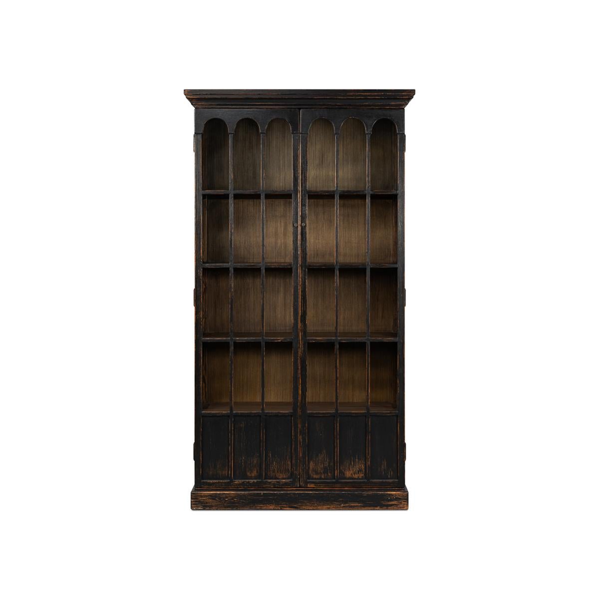 Rustic black bookcase with decorative glass doors. A beautiful and functional book or display case. This piece has two doors with Gothic era-inspired arched glass panels. This case has four adjustable shelves. 

Made of reclaimed pine with an