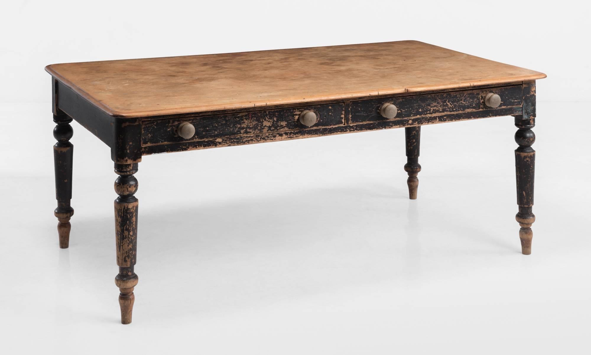 Rustic farmhouse table, circa 1860.

Scrubbed top on ebonised pine base with turned legs and drawers.
 