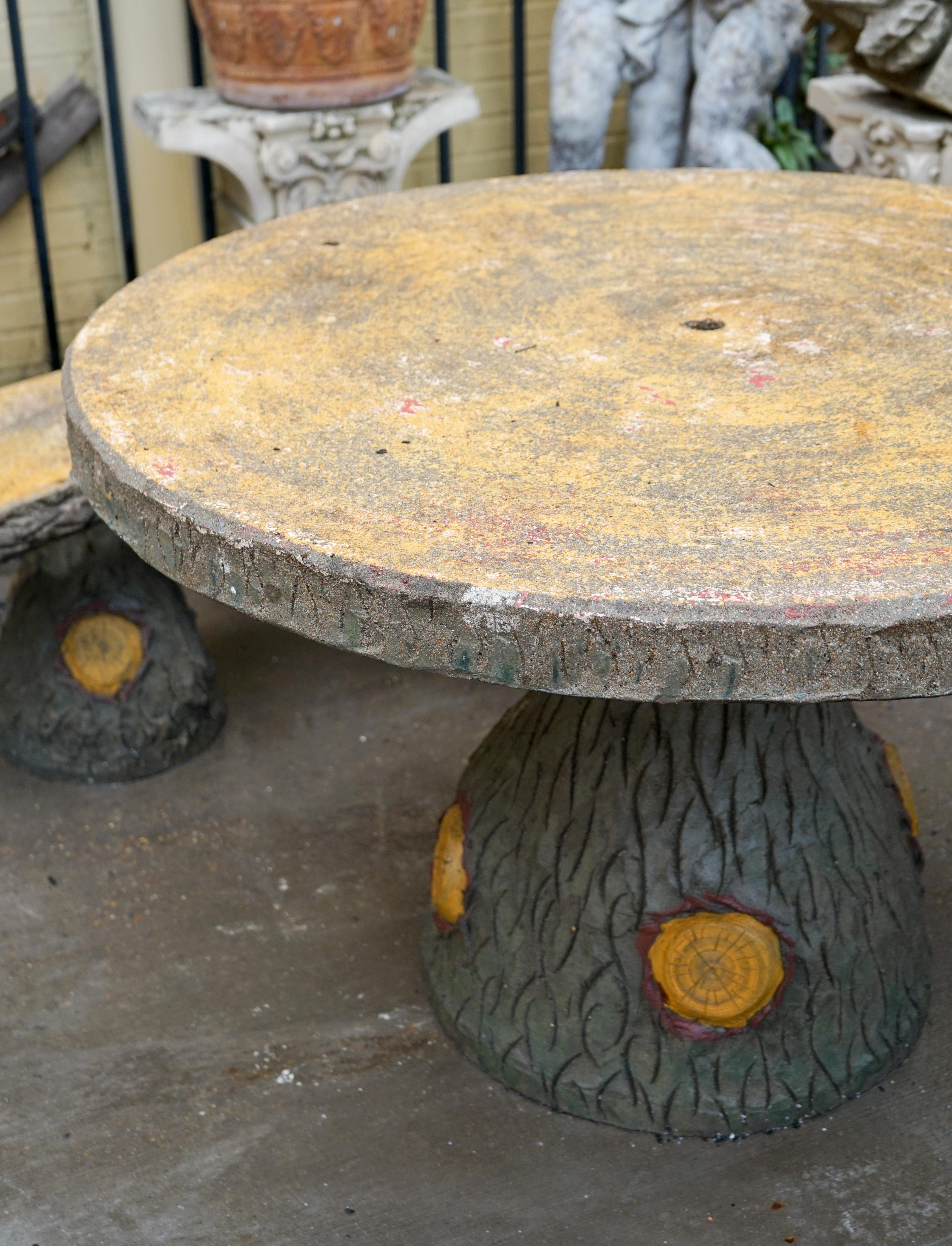 Faux bois table and bench set of mixed aggregate materials. Hand worked details on the bases in tree trunk form, topped with concrete tabletop and seat tops. Painted finish, midcentury, imported from France.

Measurements:

Tabletop diameter