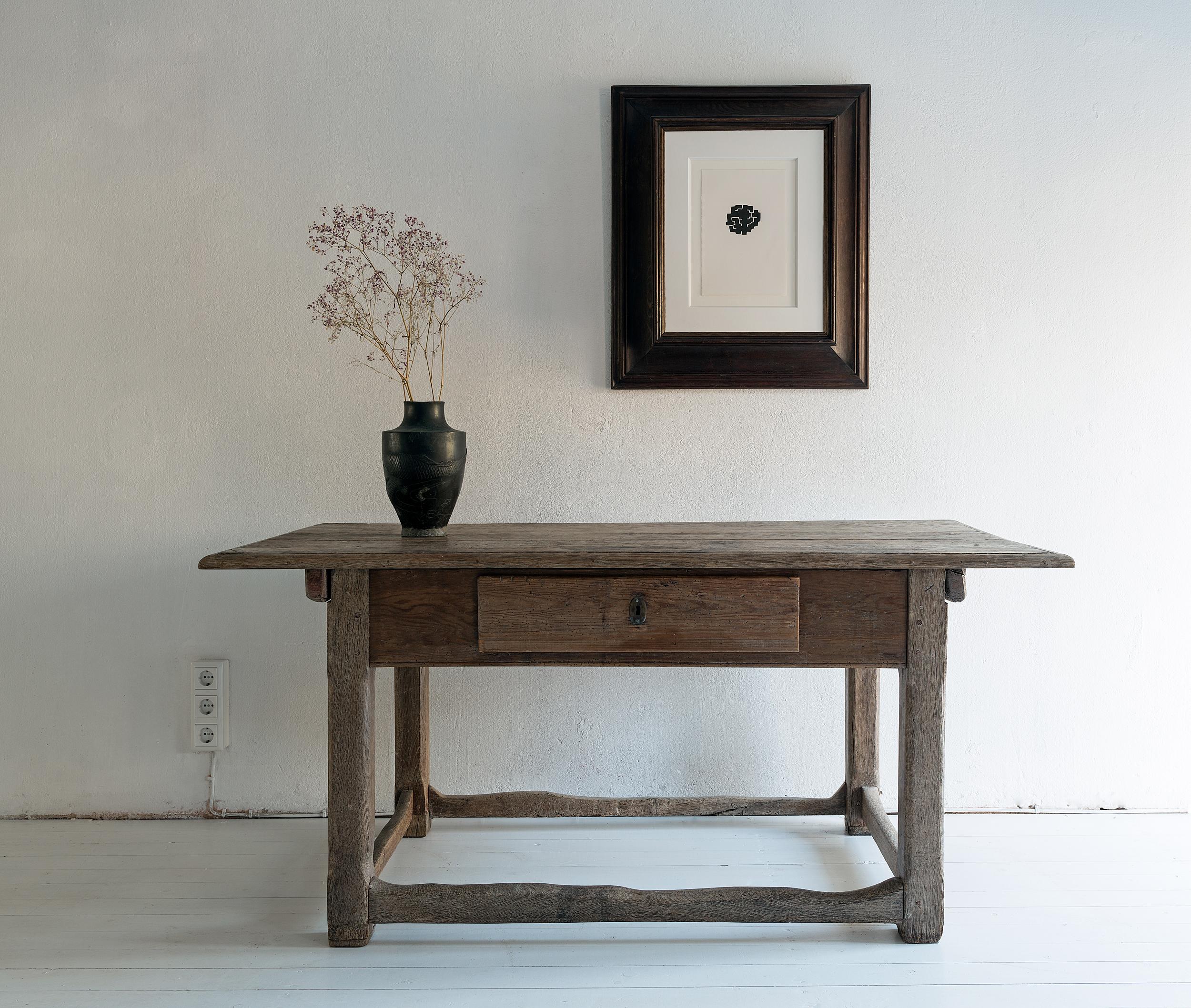 A beautiful pale oak kitchen table with great patina and signs of use- the stretchers in particular show the long happy history of the piece-
of almost modern simplicity.
