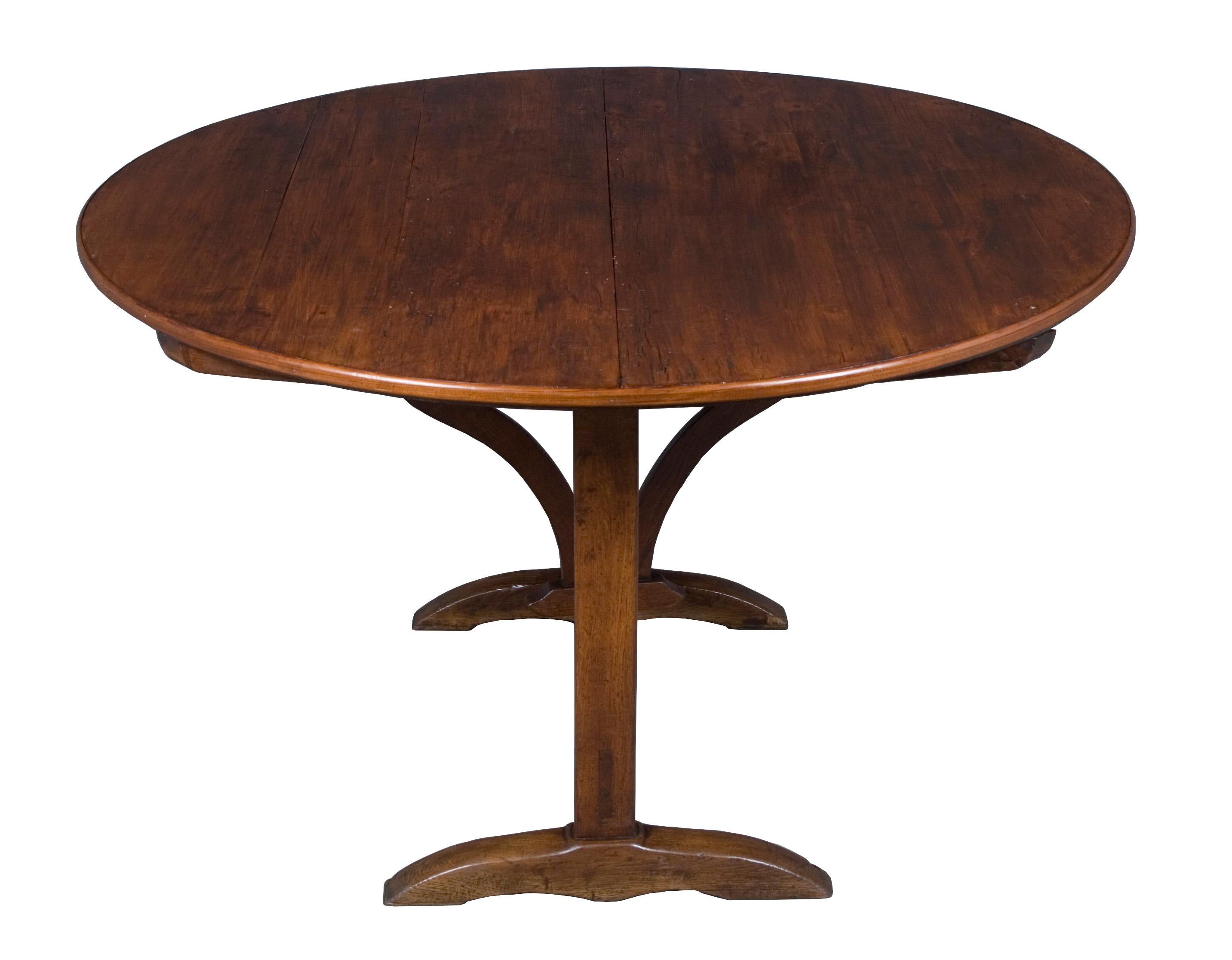 This unique Vigneron table is done with a cherry top on an oak base. It measures almost round at 46.25