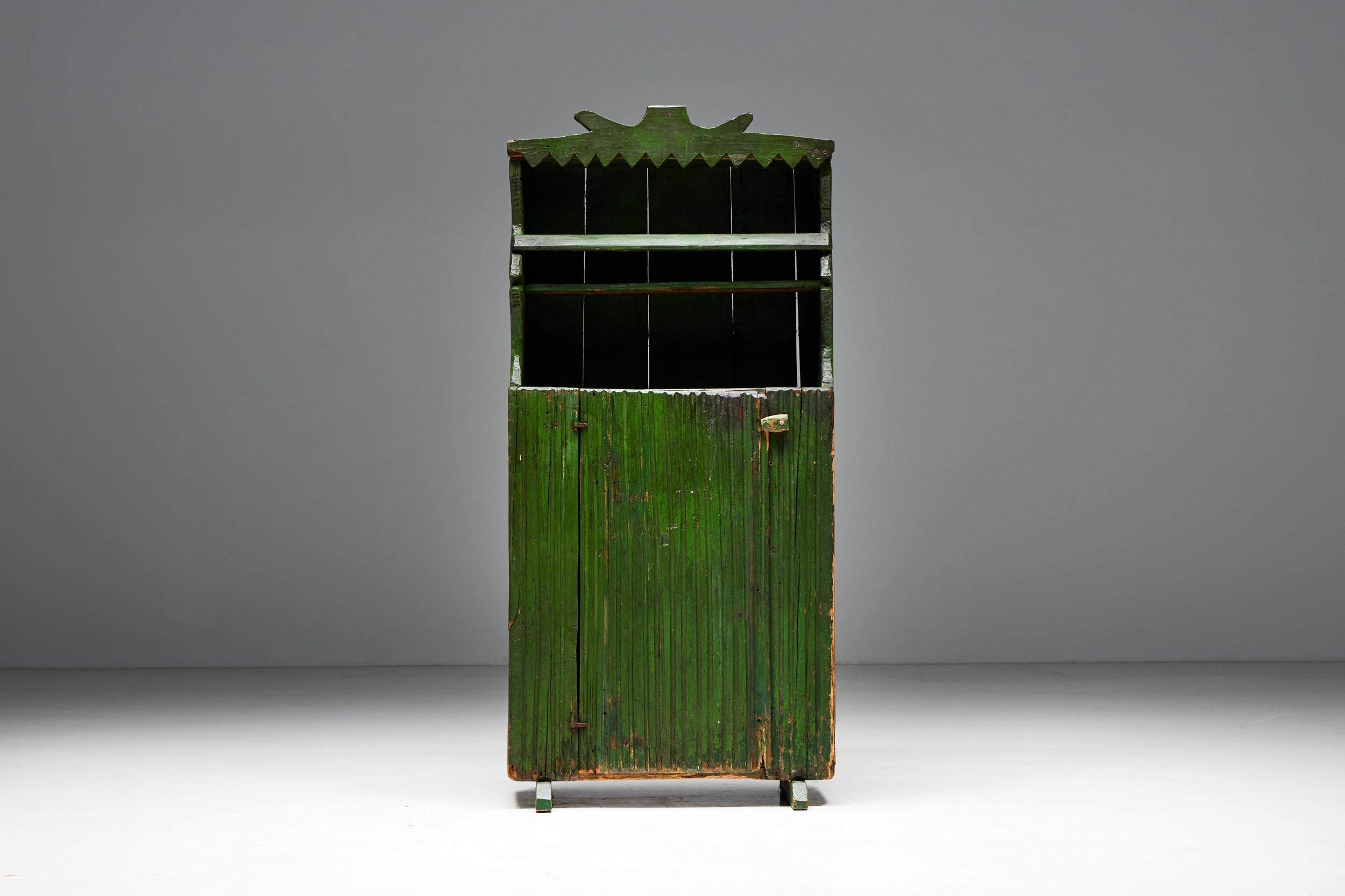 Folk Art; Art Populaire; Cabinet; Sideboard; Buffet; Rustic; Early 20th Century;

Folk art cabinet in a fascinating shade of green, a perfect blend of functionality and aesthetics. Behind the discreetly designed door, you will discover a hidden