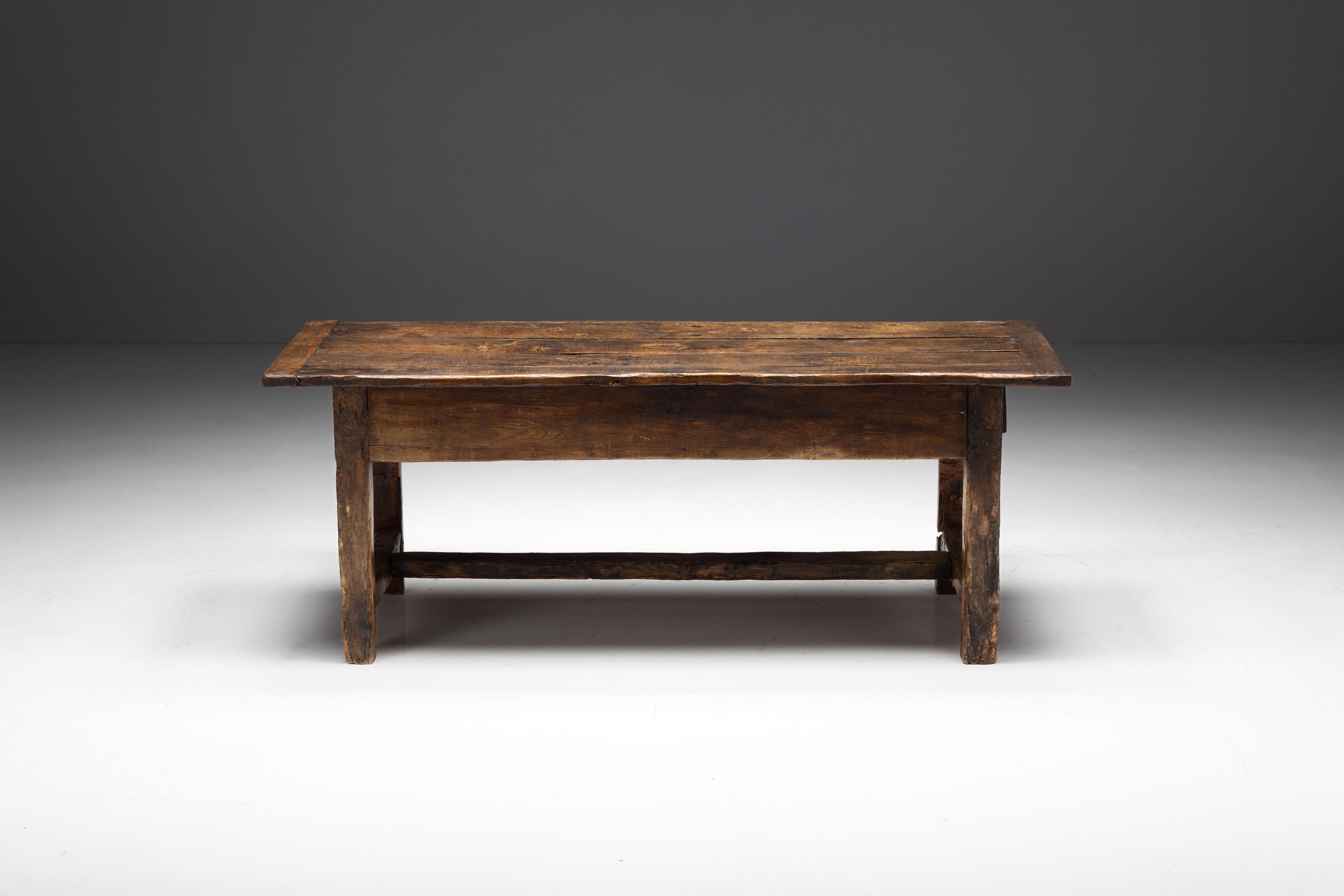Originally from 19th-century France, this farmhouse table has an endearing natural patina that enriches its rustic charm. The convenience of a drawer adds to its functionality and provides generous storage space for necessities. A symbol of French