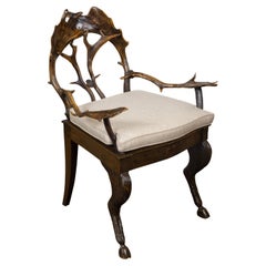 French 1880s Rustic  Fauteuil avec dossier et accoudoirs en bois de cerf, coussin