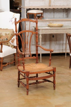 Rustic French 1890s Cherry Wood Armchair with Rush Seat and Sheaf Back