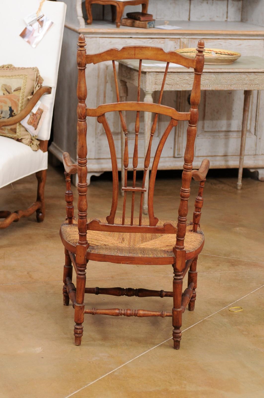 Rustic French 1890s Cherry Wood Armchair with Rush Seat and Sheaf Back For Sale 4