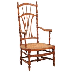 Rustic French 1890s Cherry Wood Armchair with Rush Seat and Sheaf Back