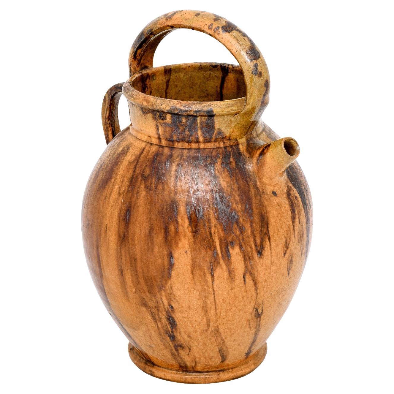 Rustic French 19th Century Olive Oil Pottery Jug with Brown and Mustard Glaze For Sale