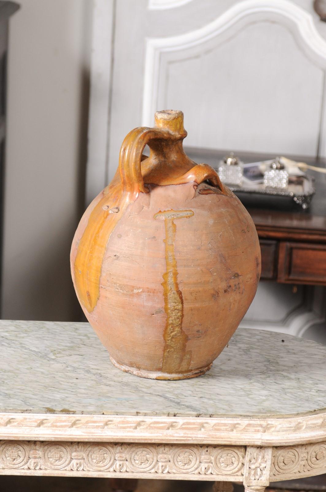 Rustic French 19th Century Pottery Jug with Yellow Glaze and Three Handles For Sale 2