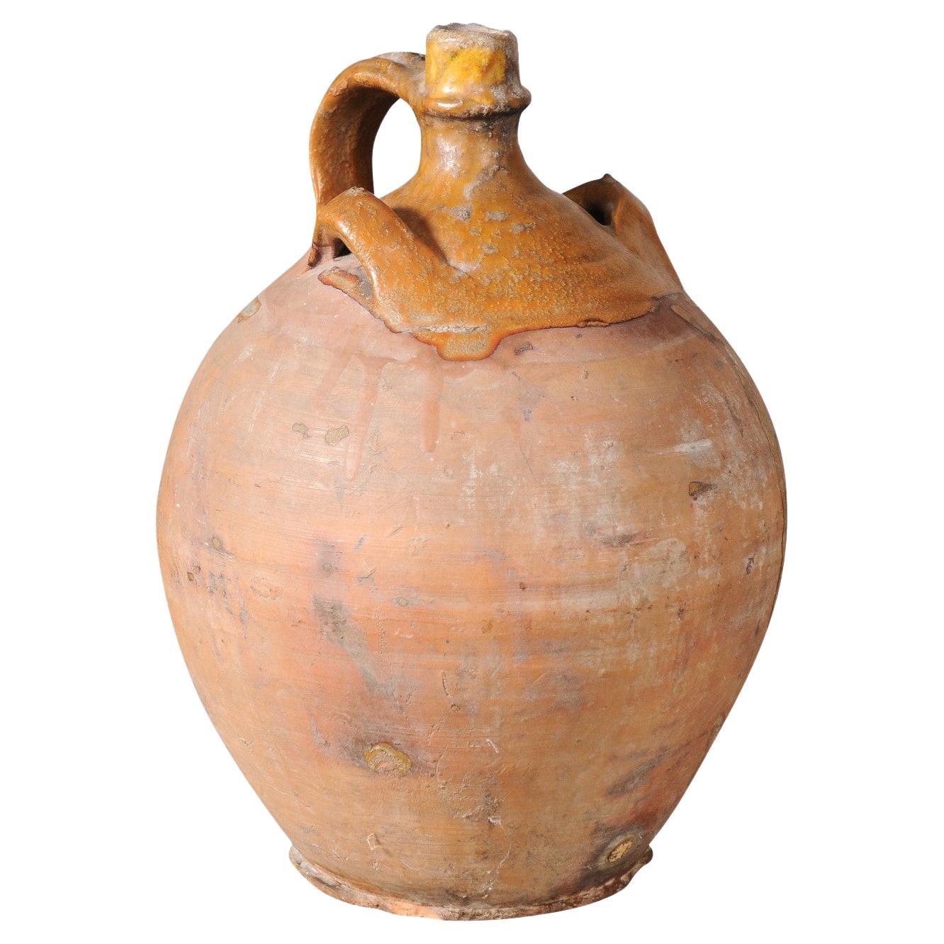 Rustic French 19th Century Pottery Jug with Yellow Glaze and Three Handles For Sale