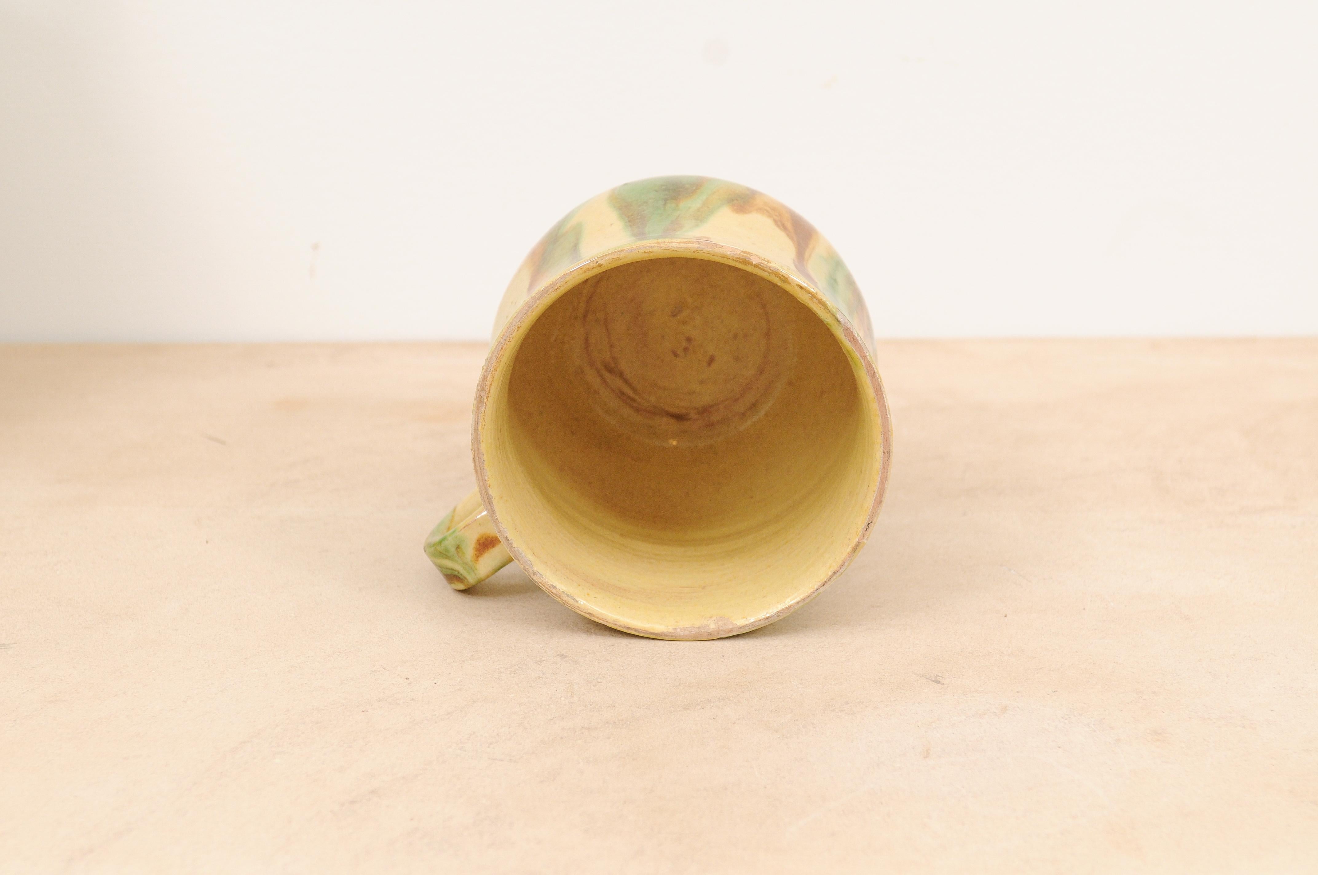 Rustic French 19th Century Pottery Mug with Yellow, Green and Rust Glaze For Sale 6