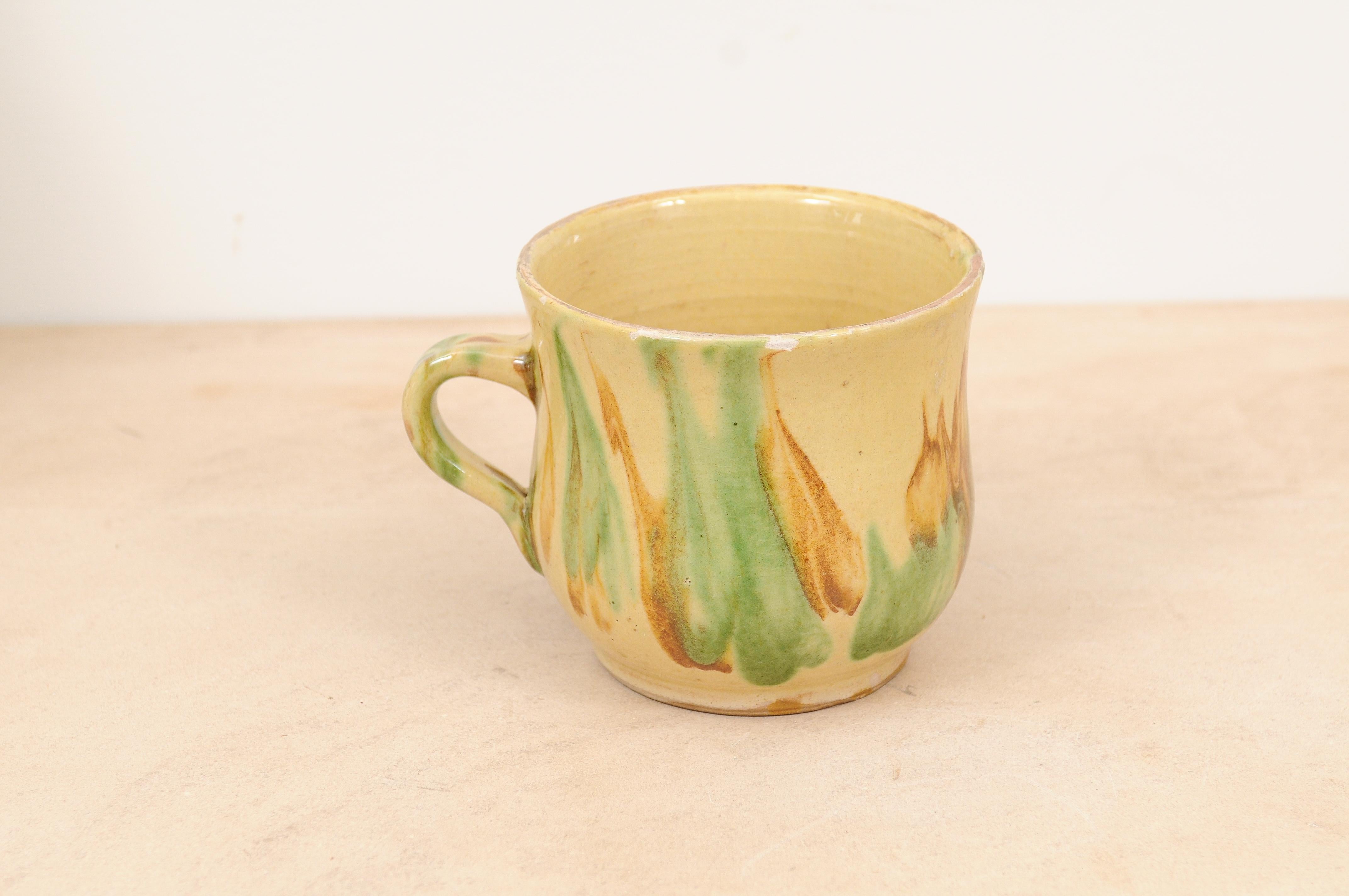 Glazed Rustic French 19th Century Pottery Mug with Yellow, Green and Rust Glaze For Sale