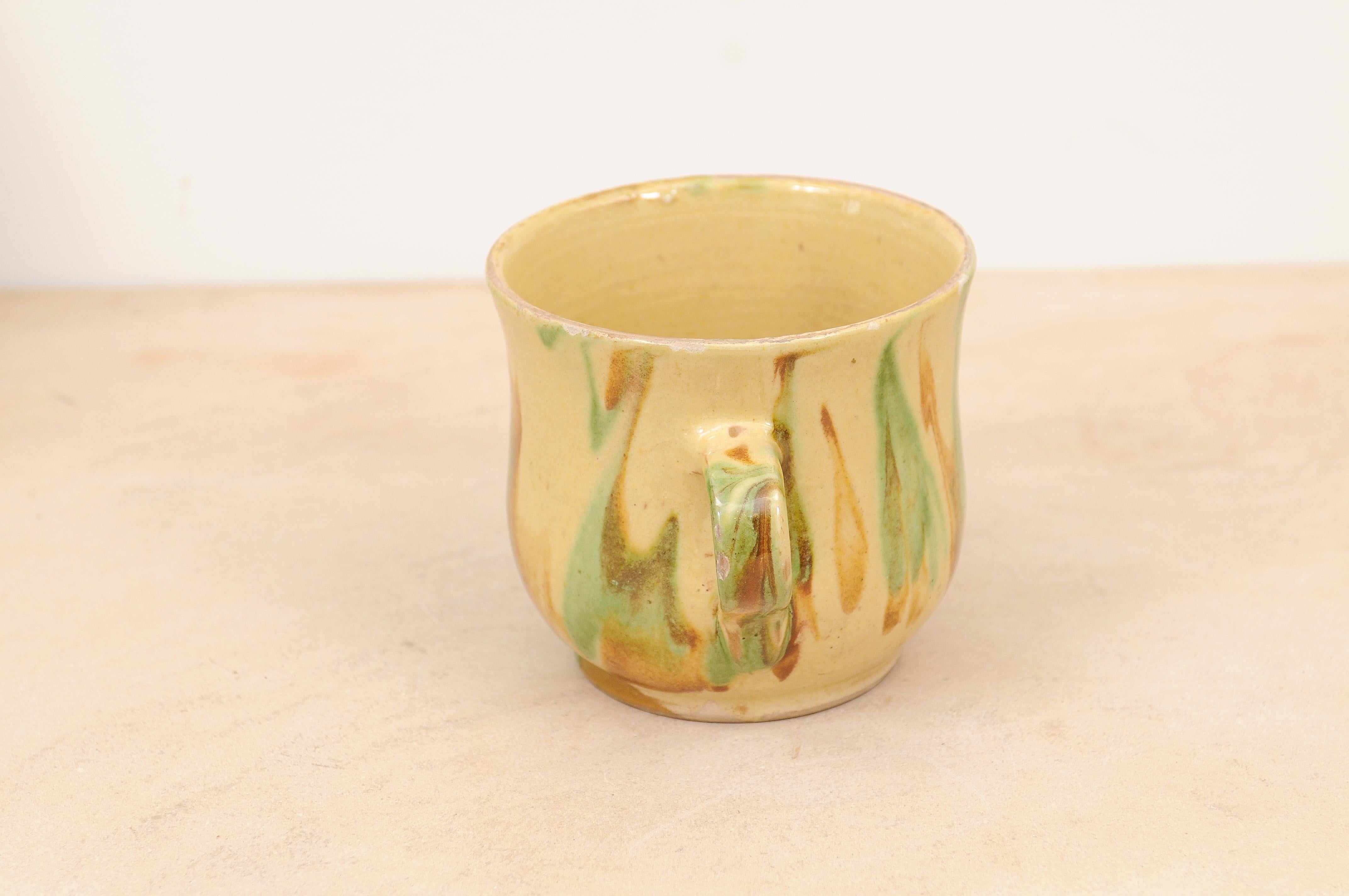 Rustic French 19th Century Pottery Mug with Yellow, Green and Rust Glaze For Sale 1