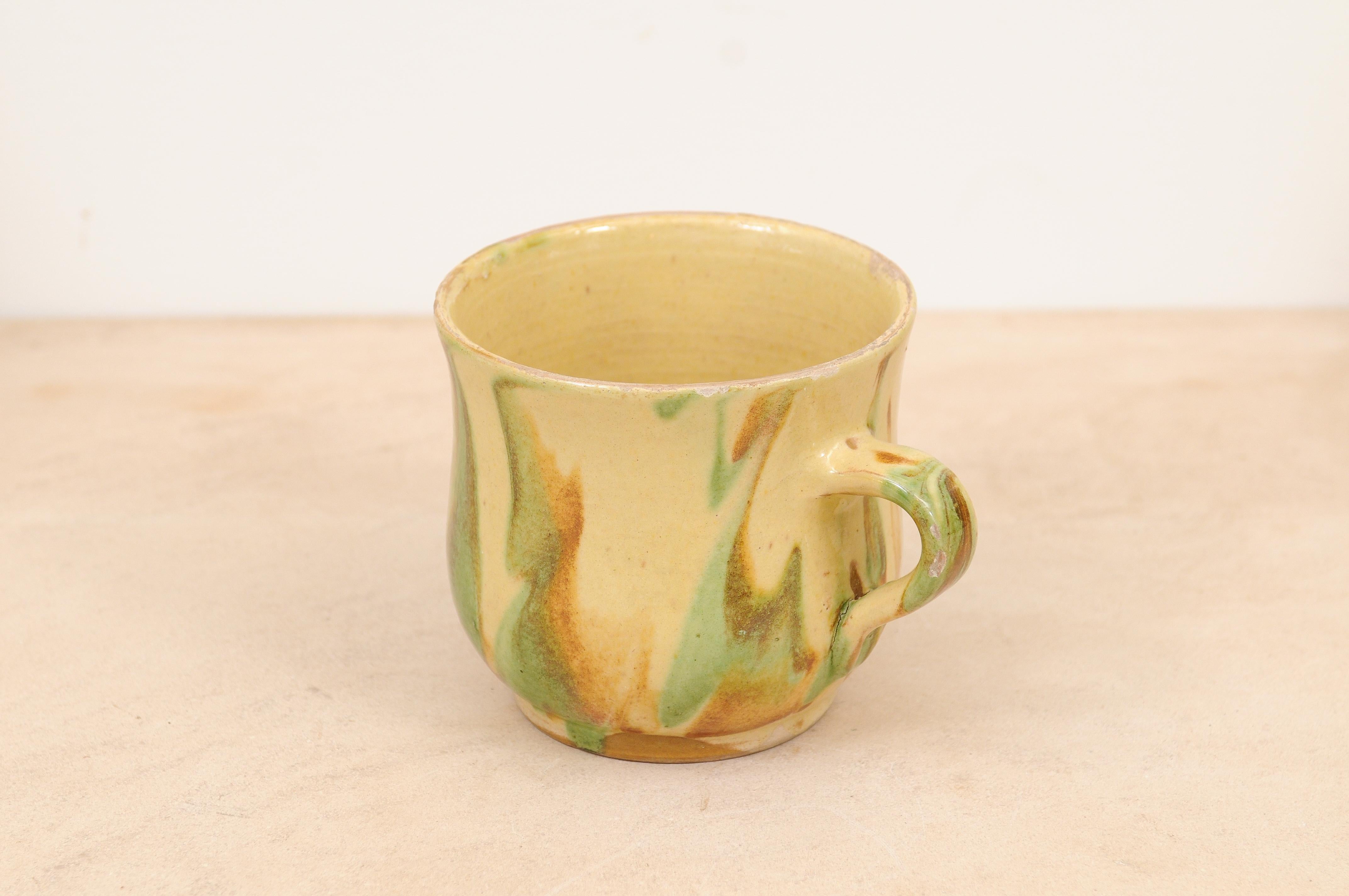 Rustic French 19th Century Pottery Mug with Yellow, Green and Rust Glaze For Sale 2