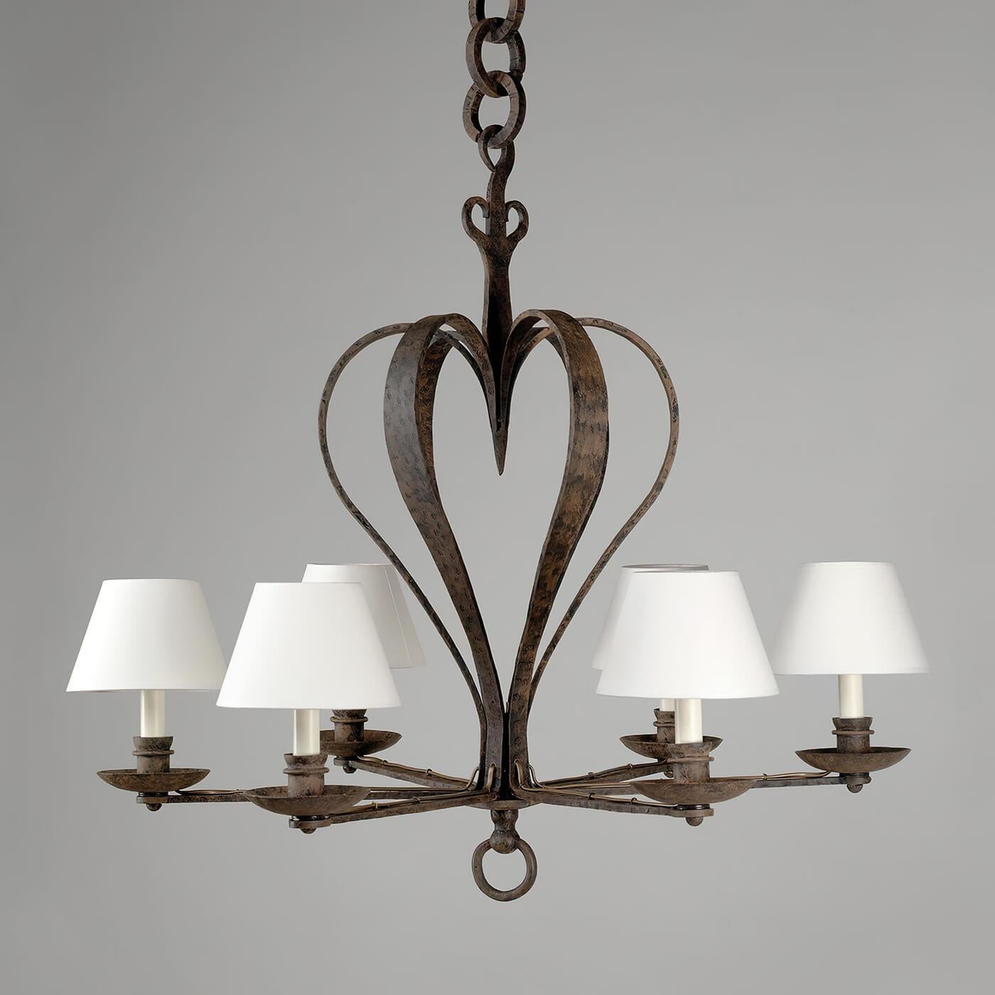 Rustic French Bastille Chandelier Based on an original discovered in a French market, the chandelier centers around a heart-shaped rustic body and is handcrafted in steel. The rust effect adds depth and gravitas.

Hand-formed from heavy-gauge