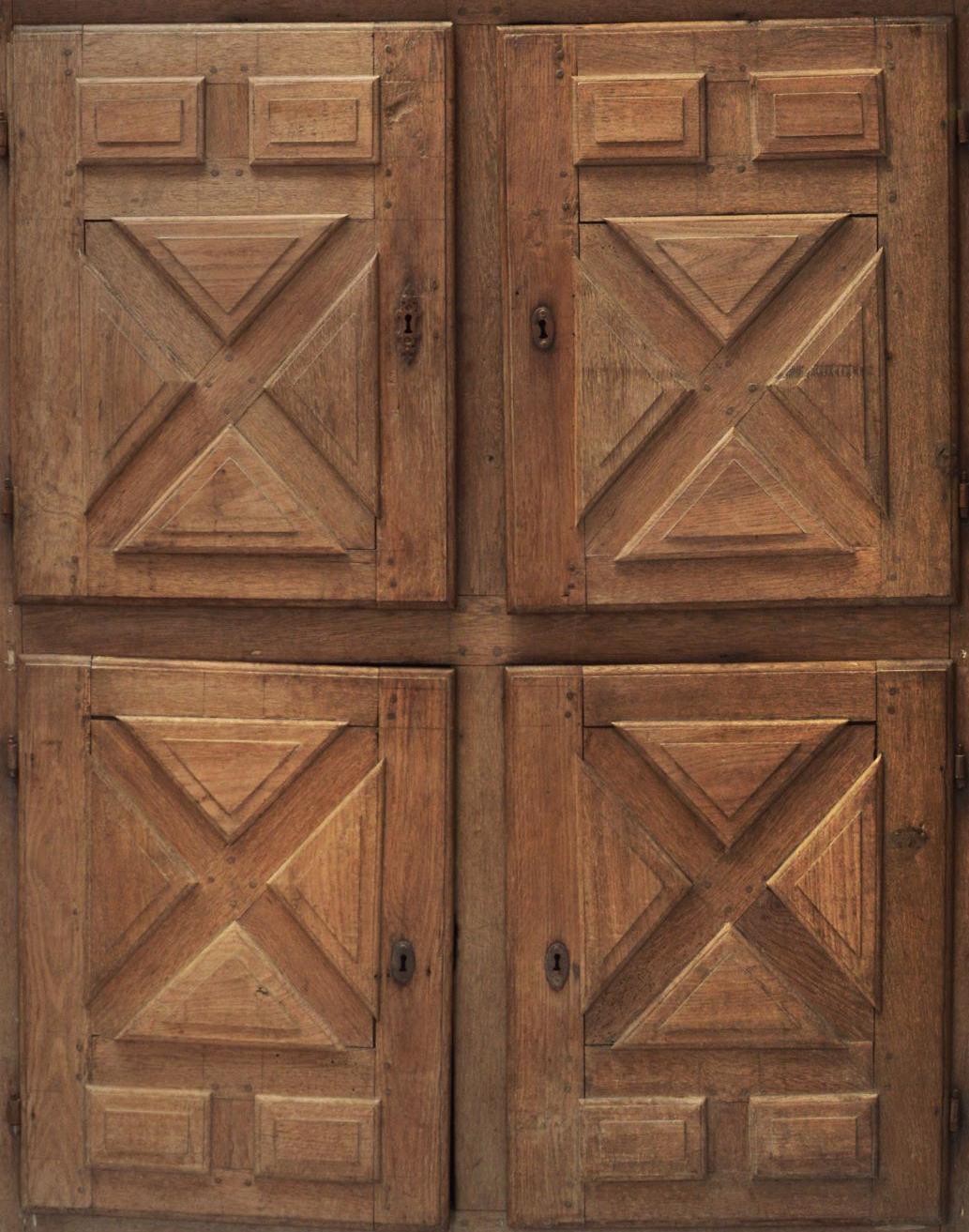 Rustic, country style French bleached oak cupboard dating from the 18th century.
The cupboard has 4 carved doors with a simple geometric motif giving it excellent decorative appeal in many settings.