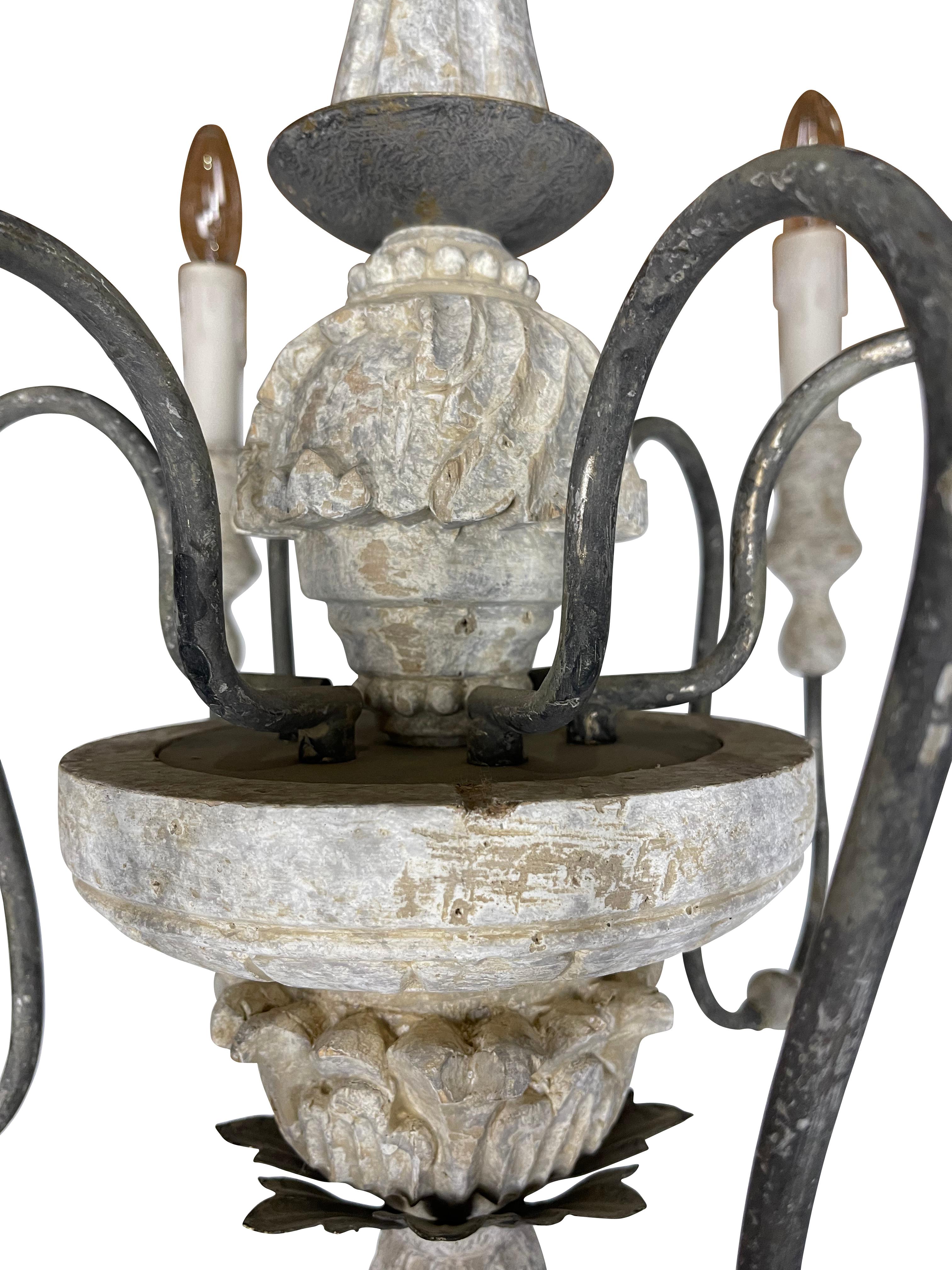 This rustic French country grey painted chandelier is nicely carved with foliate designs on the base. Graceful iron six arm chandelier with original burlap shades adds warmth and charm to any country interior space. Nice diminutive size measures