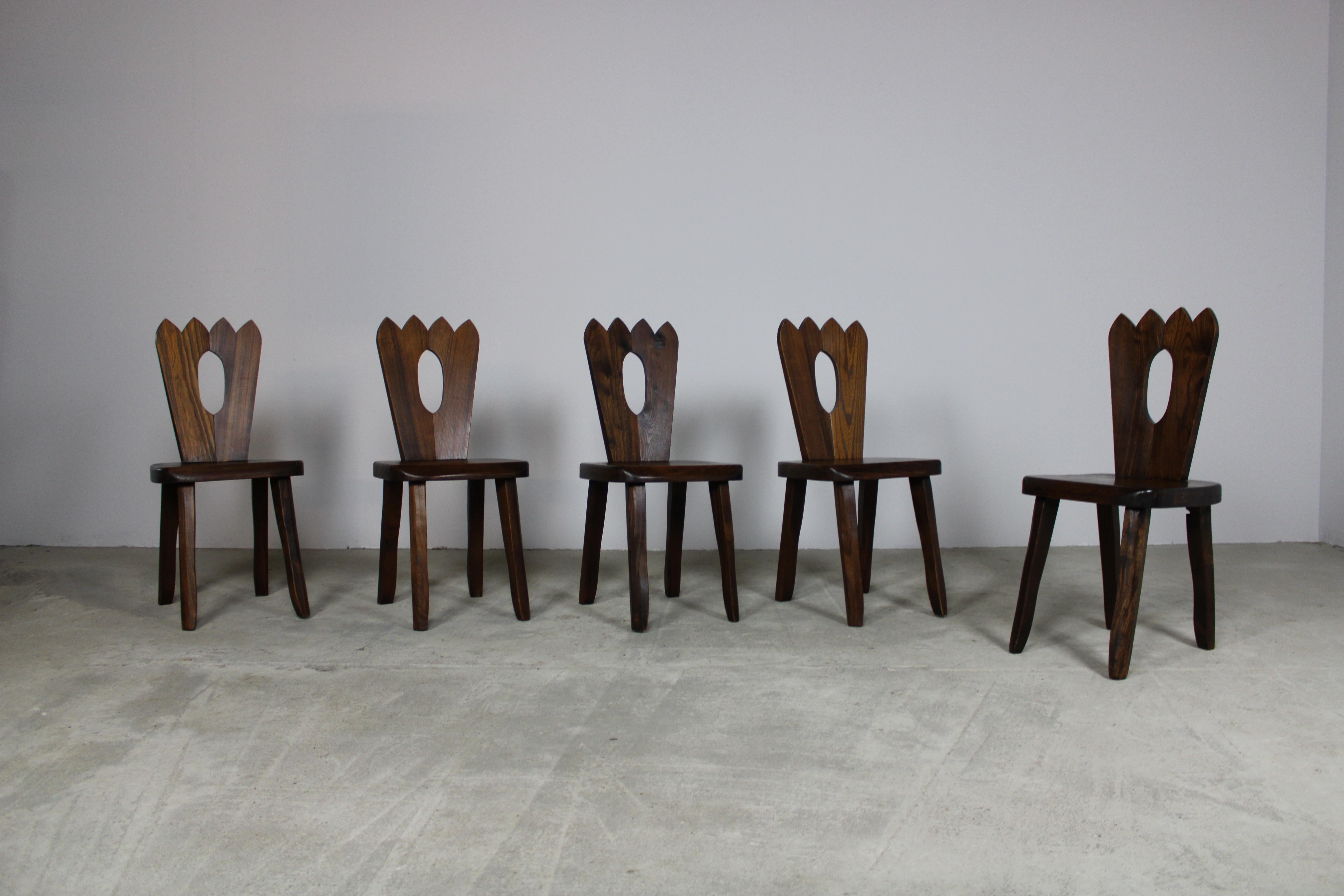 These dining chairs stand as a testament to timeless beauty, blending classic elegance with natural allure. Crafted from sturdy elm wood, these chairs exude a distinctive charm, characterized by the wood's attractive grain patterns, durability, and