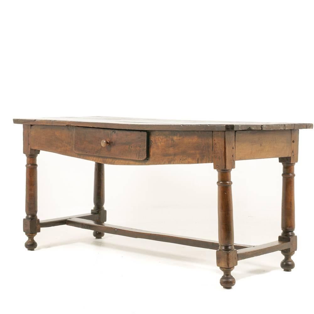 A French oak farm table with a beautiful, dark patina, one side with a drawer fitted to the skirt, 

circa 1850-1870.



