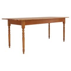 Antique Rustic French farm table in wood with turned legs, ca. 1850
