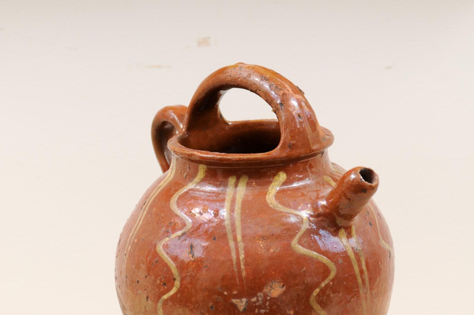 Rustic French Glazed Terracotta 19th Century Oil Jug with Distressed Appearance In Good Condition For Sale In Atlanta, GA