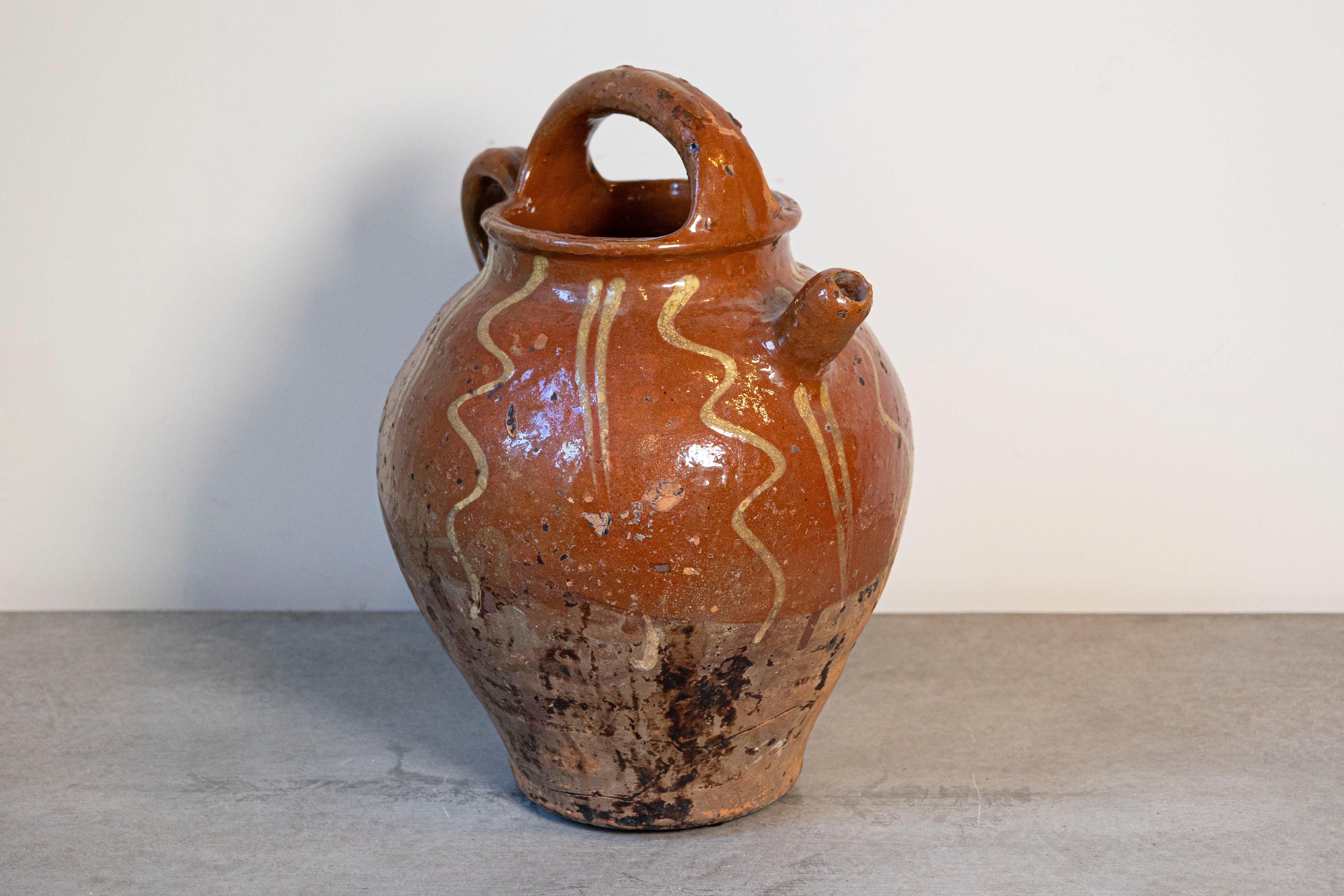 Rustic French Glazed Terracotta 19th Century Oil Jug with Distressed Appearance In Good Condition For Sale In Atlanta, GA