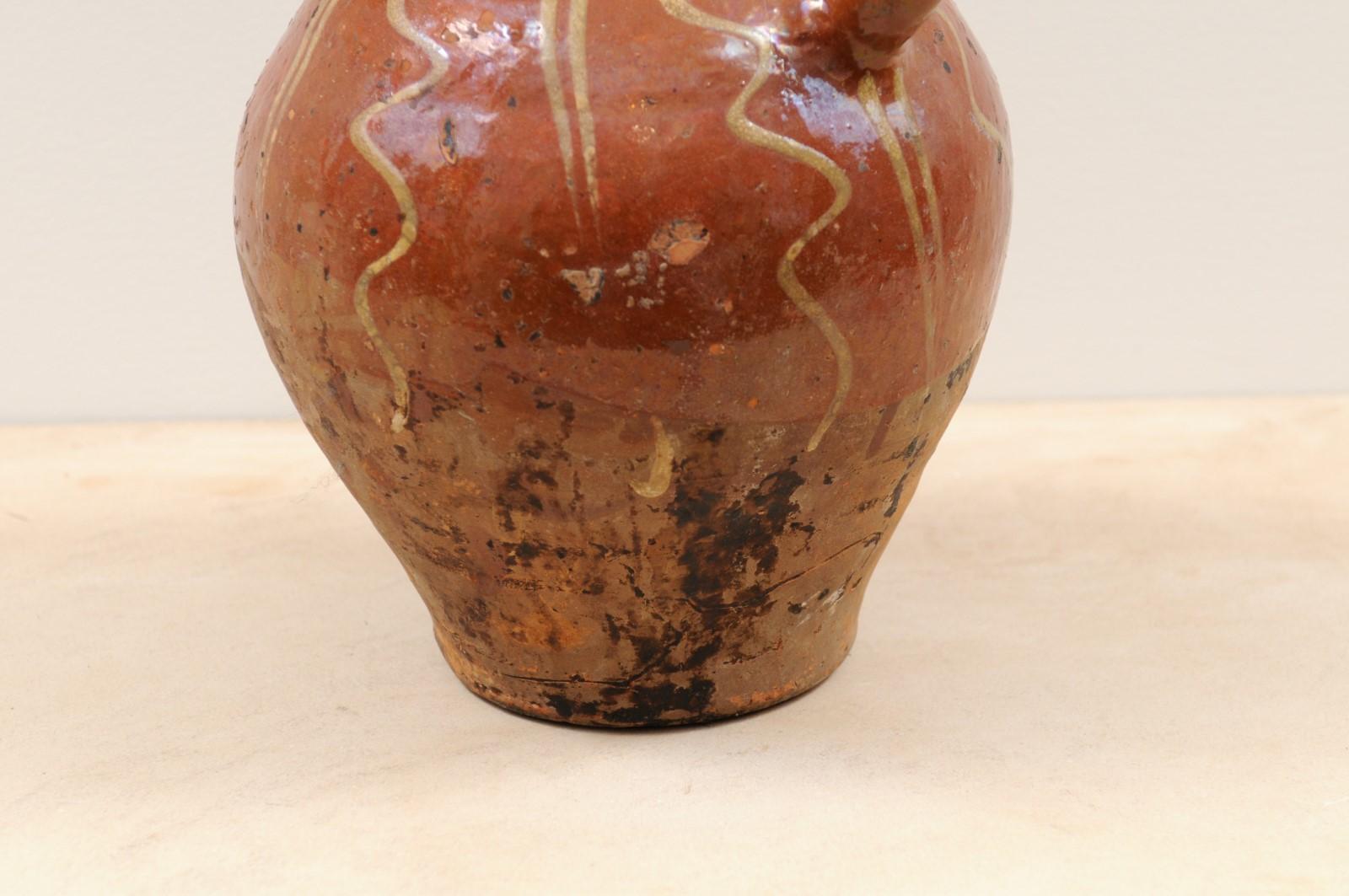 Rustic French Glazed Terracotta 19th Century Oil Jug with Distressed Appearance For Sale 1