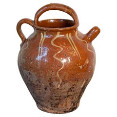 Brocca da olio rustica francese in terracotta smaltata del XIX secolo, con aspetto rovinato