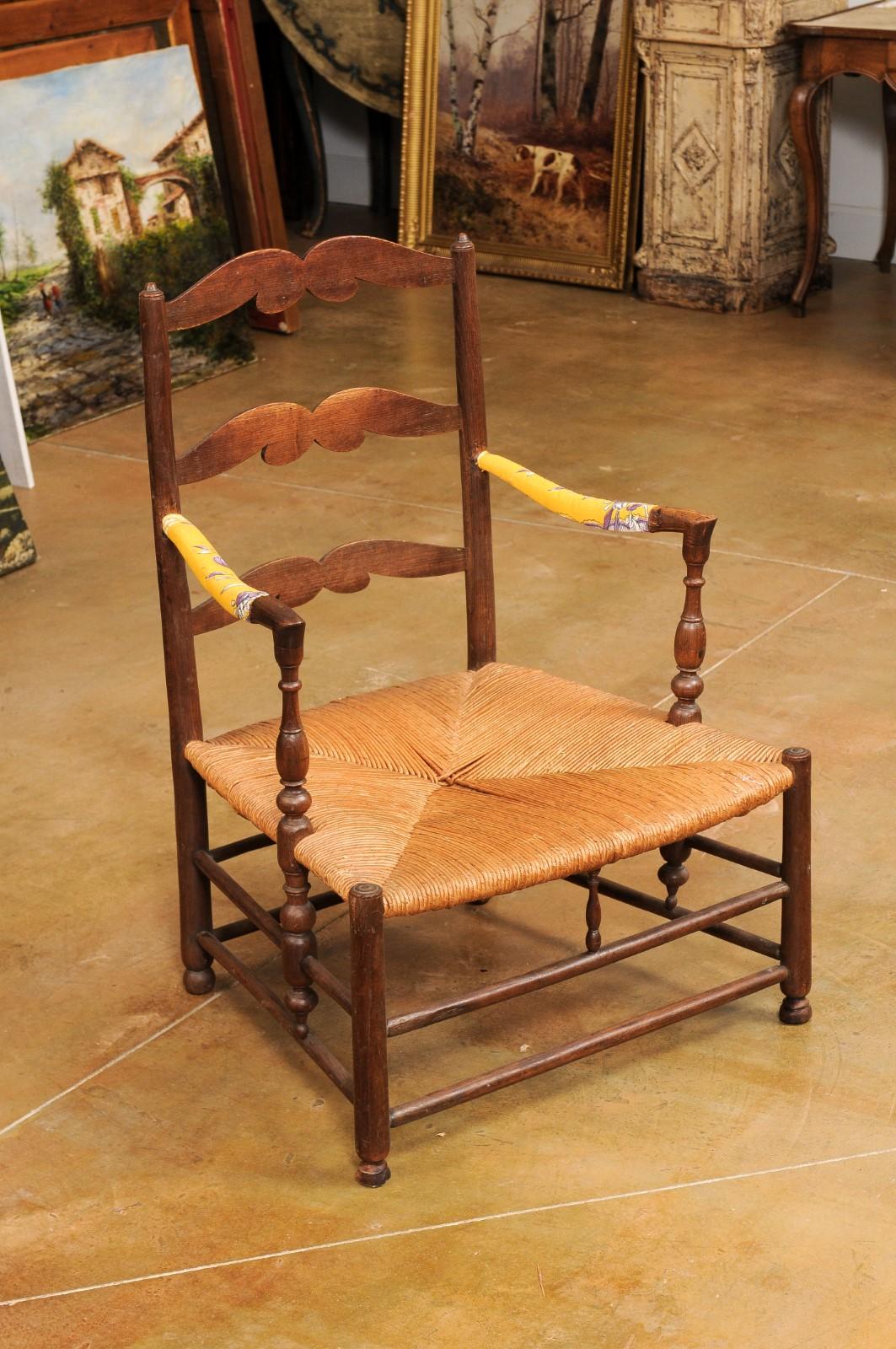 Rustic French Late 18th Century Walnut Armchair with Rush Seat and Cushion For Sale 1