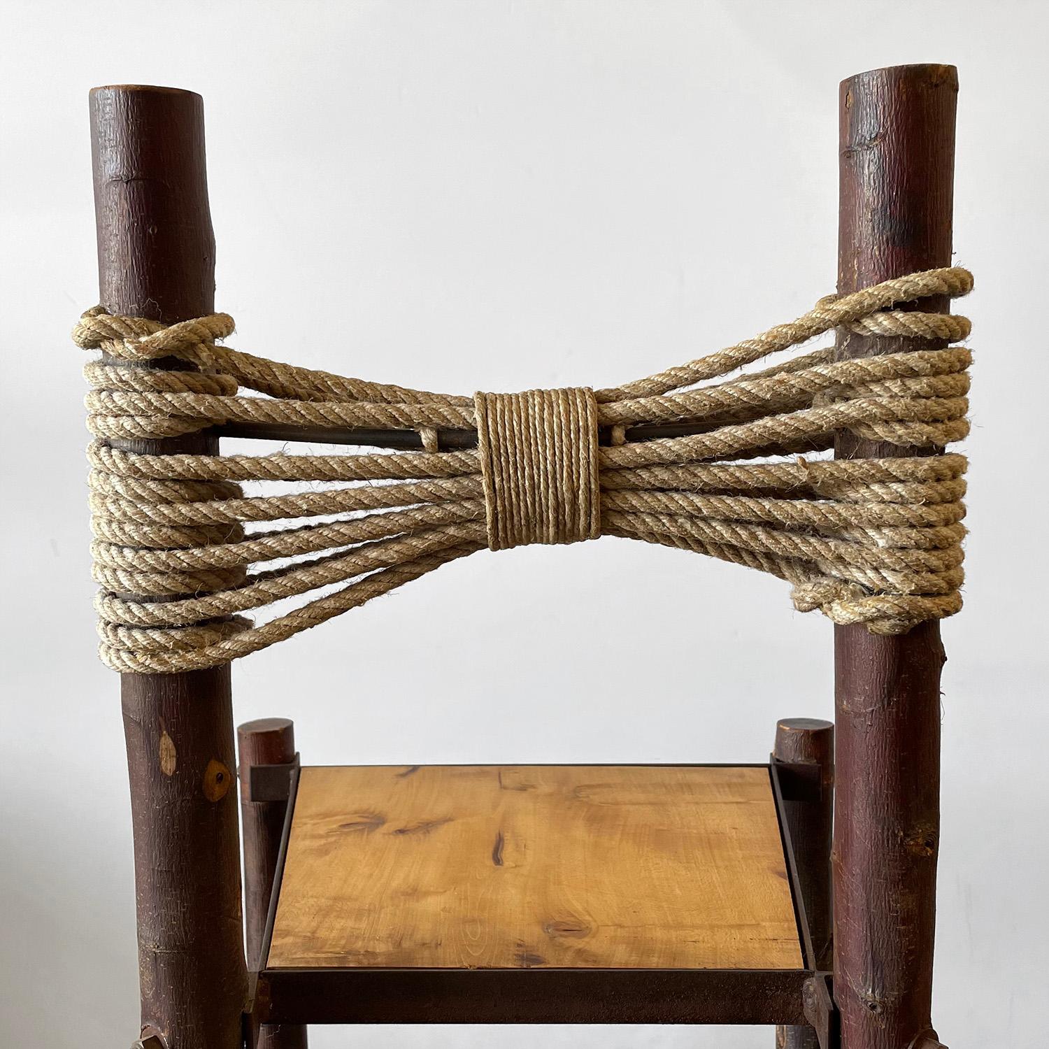 French primitive chair
France, early 20th century
Artisan crafted, rustic look and feel
Chair frame is made of raw wood
Bowtie back support is comprised of braided rope
Patina from age and use
Last two are for size reference only
Listing is