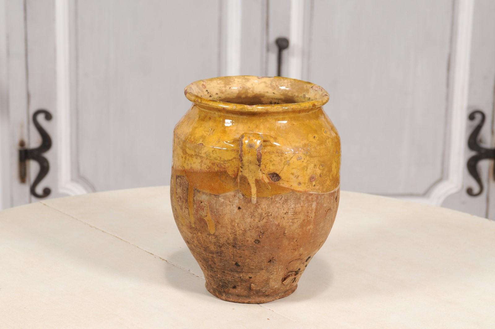 Rustic French Provincial Double Handled Pottery Pot à Confit with Yellow Glaze In Good Condition For Sale In Atlanta, GA