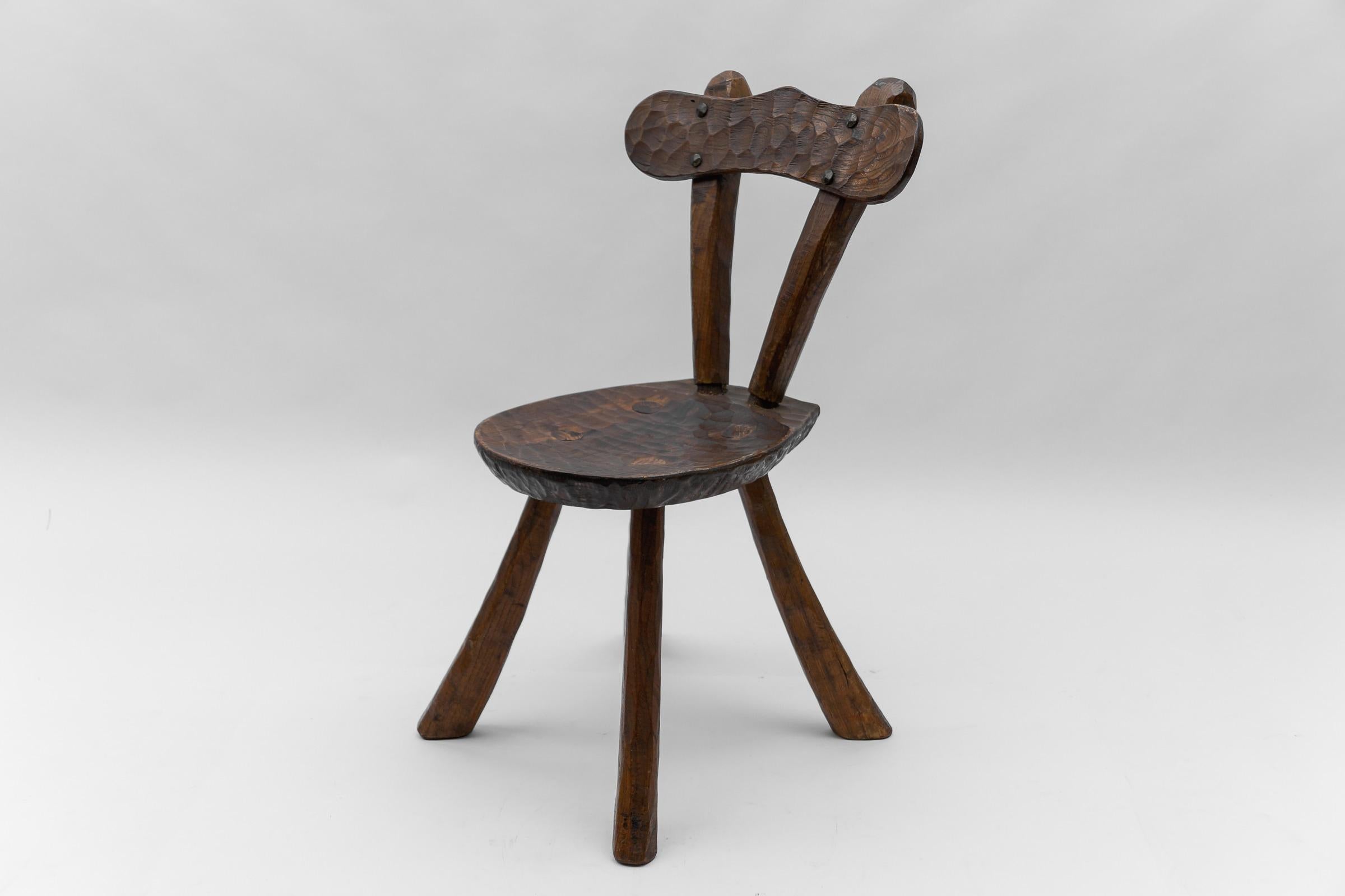 Rustic French Provincial Sculptured Chair in the Style of Alexandre Noll, 1960s

The seat width is 32 cm, the seat depth 35 cm and the seat height 38 cm. 
The overall width is 42cm, the overall depth is 49cm and the overall height is 75cm.

We have