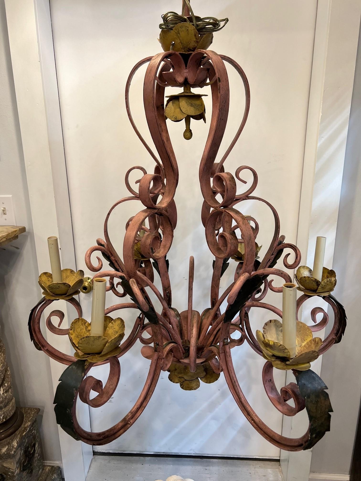 Rustic French style wrought iron six light chandelier. This is a nice heavy iron chandelier with acanthus leaf design and iron scroll work. It's a good size with a colorful painted finish that has been recently wired for chandelier bulbs. Would look