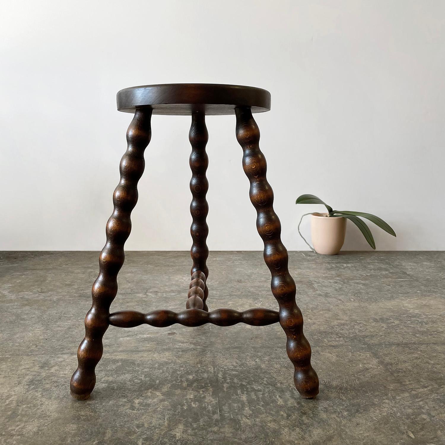 French wood tripod stool
France, mid-century
Can be used as a stool or side table
Circular seat with whimsical turned wood tripod legs
Original wood finish with lovely grain detail
Patina from age and use
Second stool available, sold