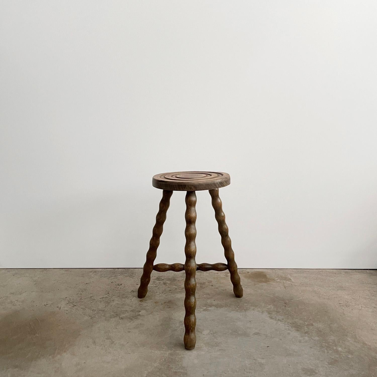Rustic French wood tripod stool
France, mid-century
Can be used as a stool or side table
Circular seat with whimsical turned wood tripod legs
Original wood finish with lovely grain detail
Patina from age and use