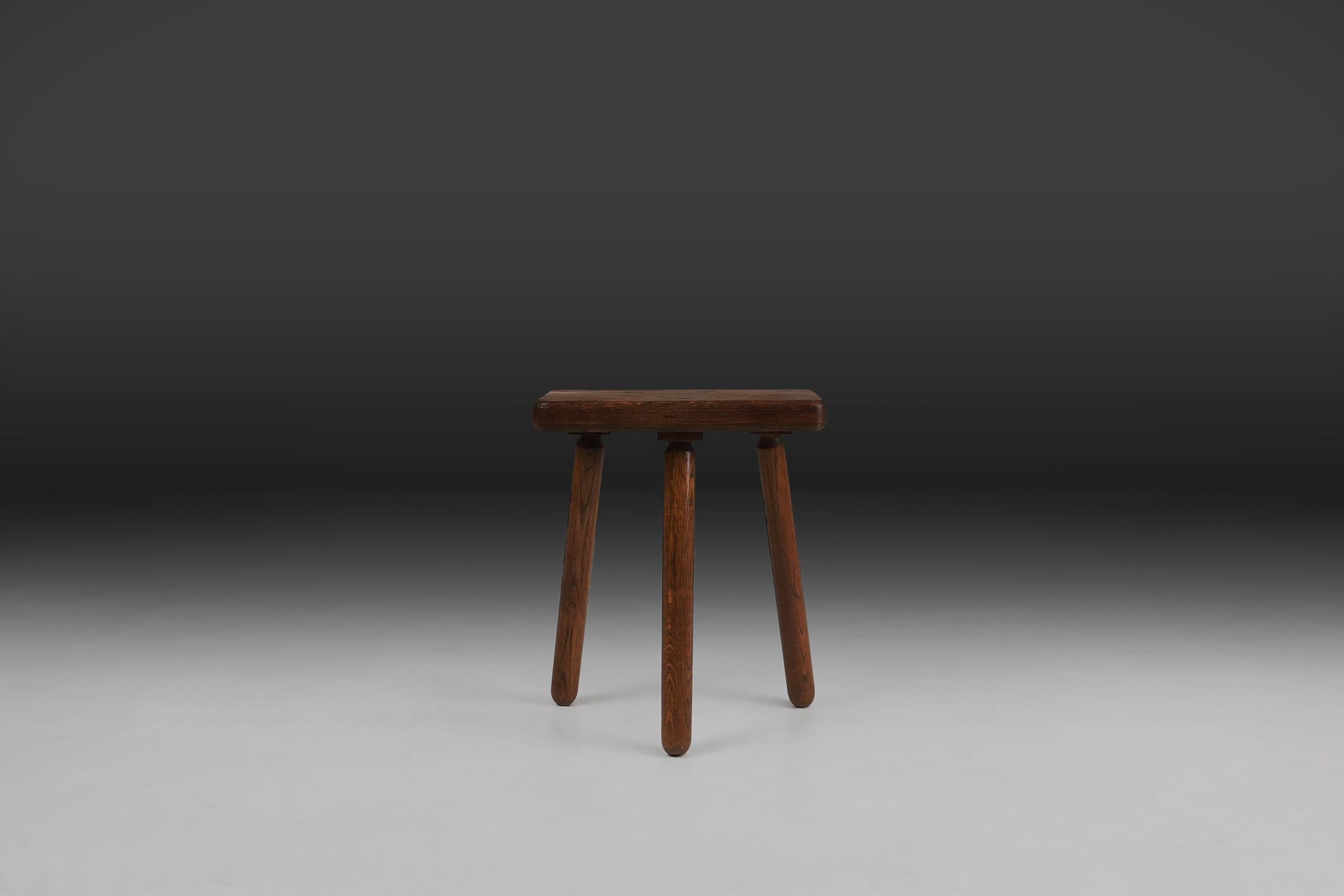 a unique and authentic French stool made in the 1940s.

Made of full wood, this stool exudes warmth and durability. The rich brown colour, enhanced by a natural patina, gives the wood character and tells a story of decades.

The stool has three