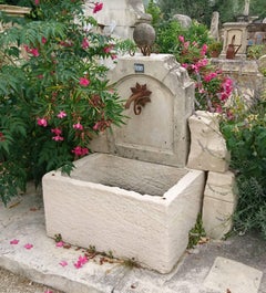 Rustic Garden Wall Fountain with Antique Stone Trough and Iron Rosette, Provence