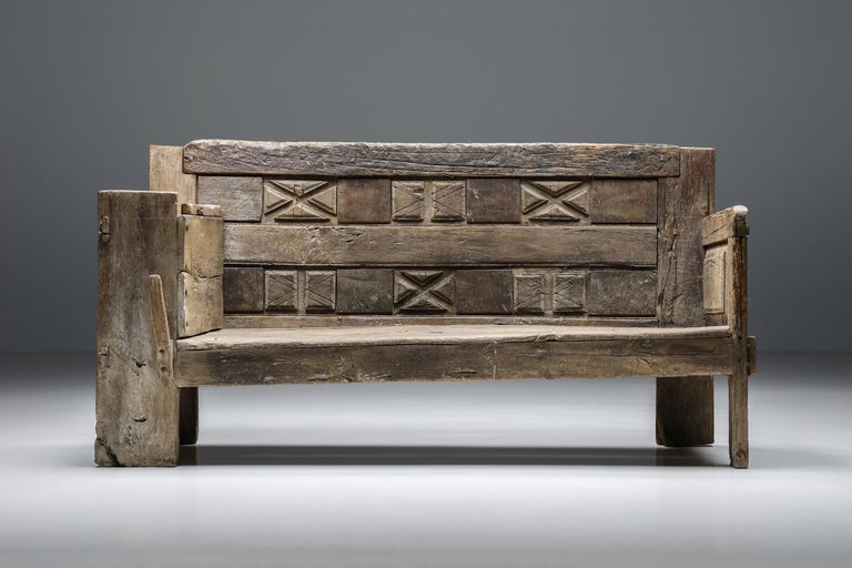 French craftsmanship; Rustic; wood; bench; seating element; sofa; hand-made; one-of-a-kind; 

Rustic wooden bench with remarkable hand-made graphical details in the backrest and armrests. A true sign of French craftsmanship of the 1800s. The