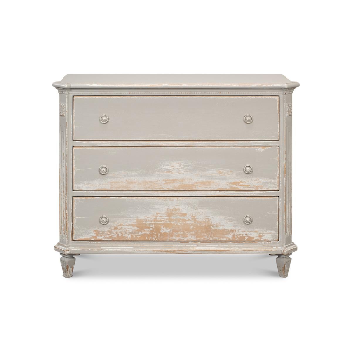 Made with reclaimed pine and finished in a distressed and antiqued gray paint. With a molded edge top having canted corners, fluted styles above square tapered and fluted legs.

Dimensions: 47