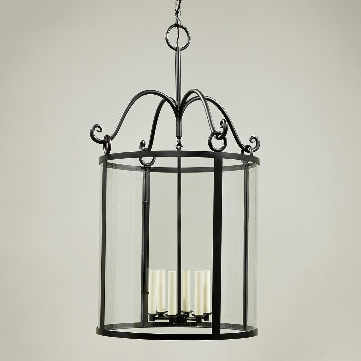 Rustic hall lantern, a whimsical design, this large hall lantern has a slightly rustic feel to it thanks to the swirling arms. Finished in black and hanging from a chain, it strikes a simple yet sophisticated note.

The Holbury Lantern is