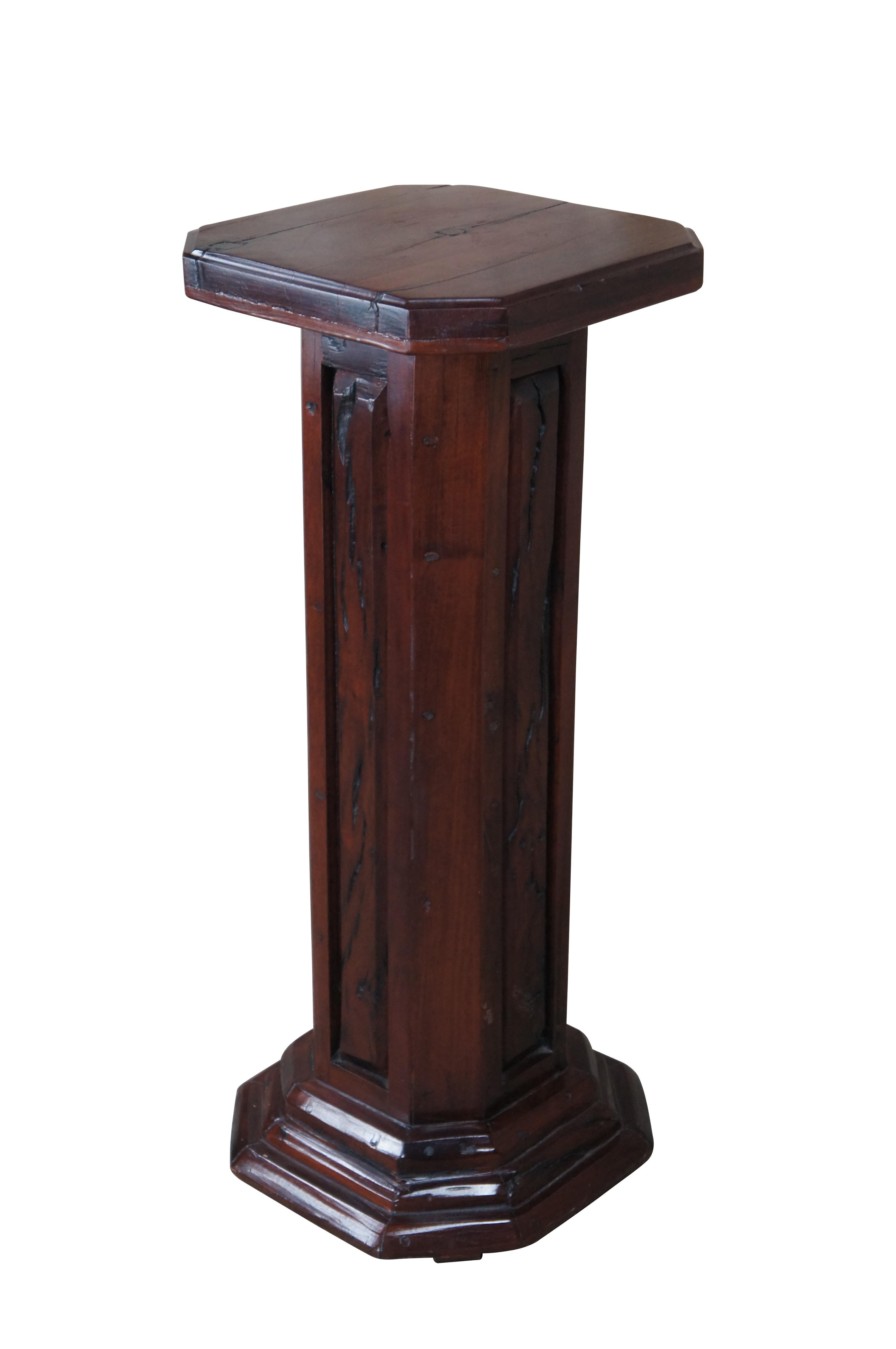 Traditional hardwood sculpture pedestal or plant stand.  Features an eight sided design with paneled support.  Marked along underside.

Dimensions:
13