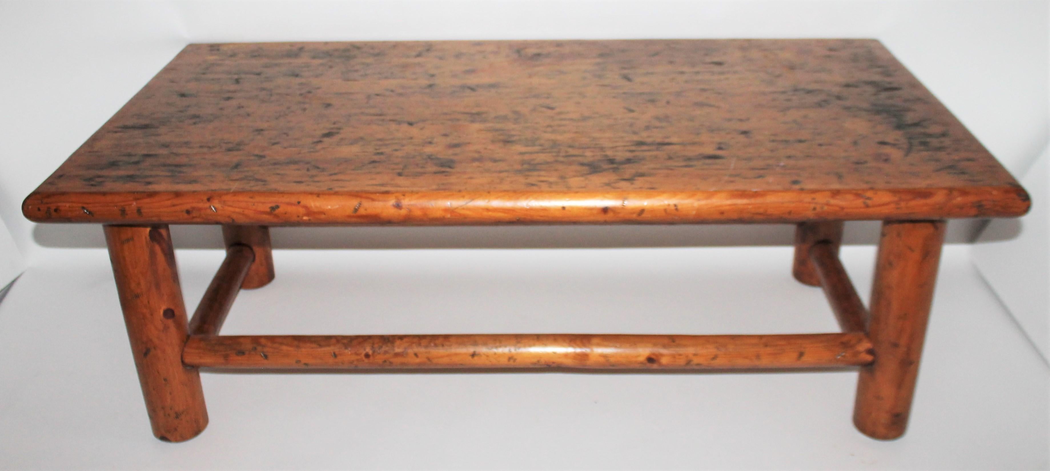 This rustic hickory and pine coffee table is handmade in Oregon. It is stamped on the bottom of the table top.