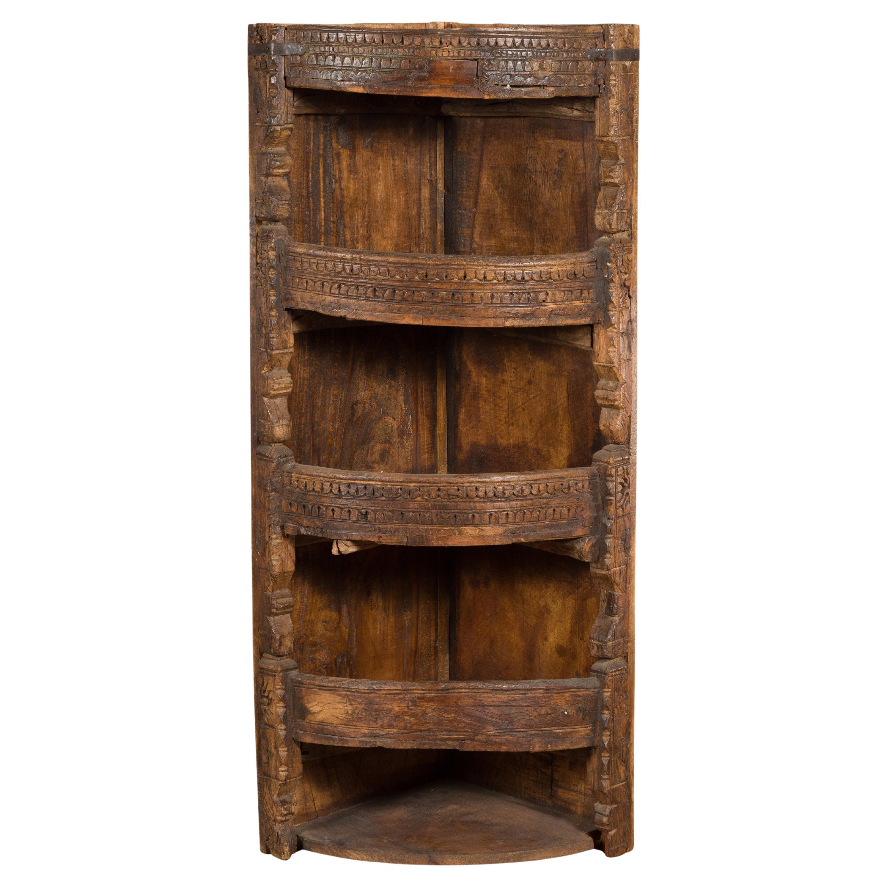 Rustic Indian 19th Century Corner Cabinet with Carved Motifs and Shelves For Sale