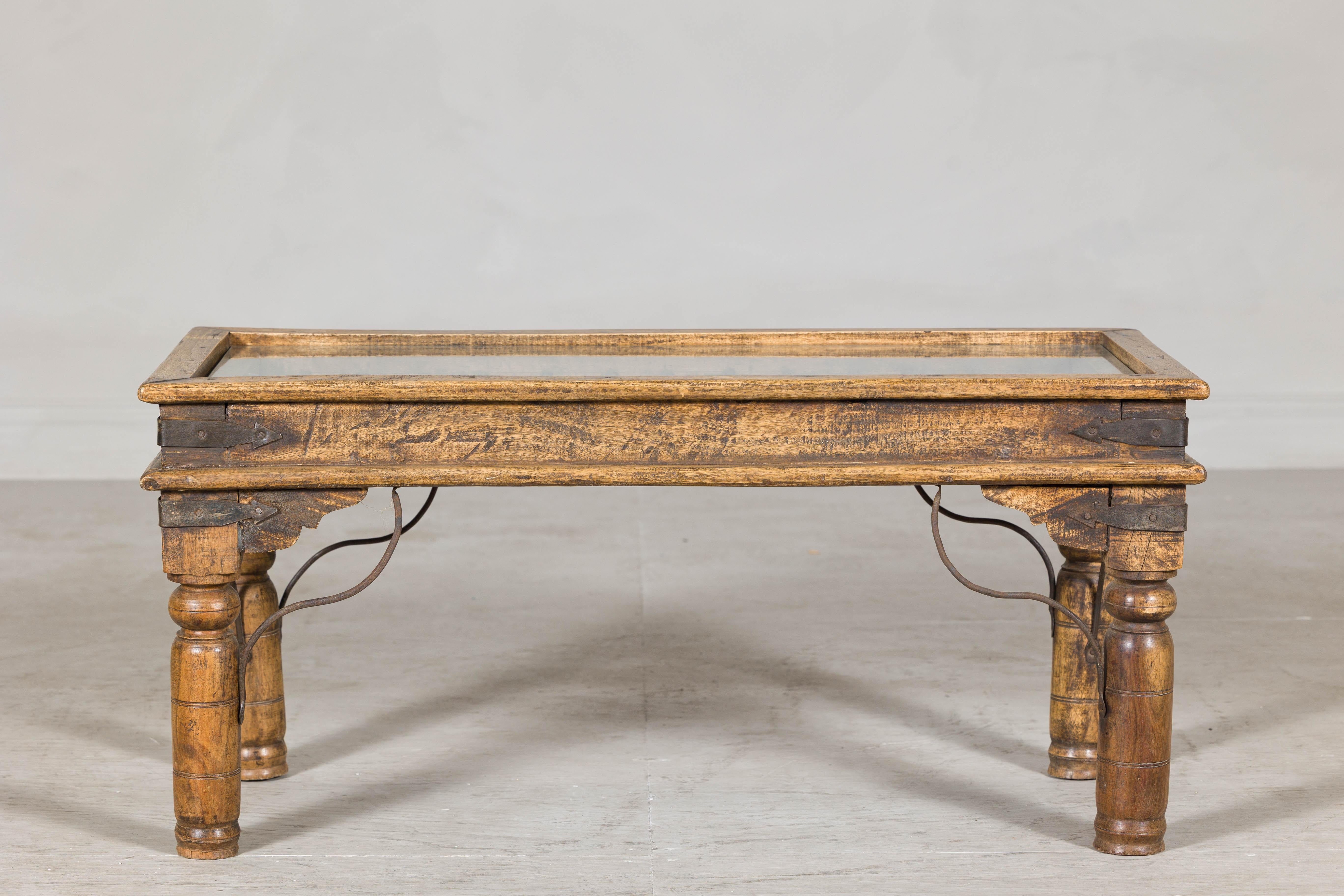 Rustic Indian Coffee Table with Antique Ironwork and Custom Glass - Vintage In Good Condition For Sale In Yonkers, NY
