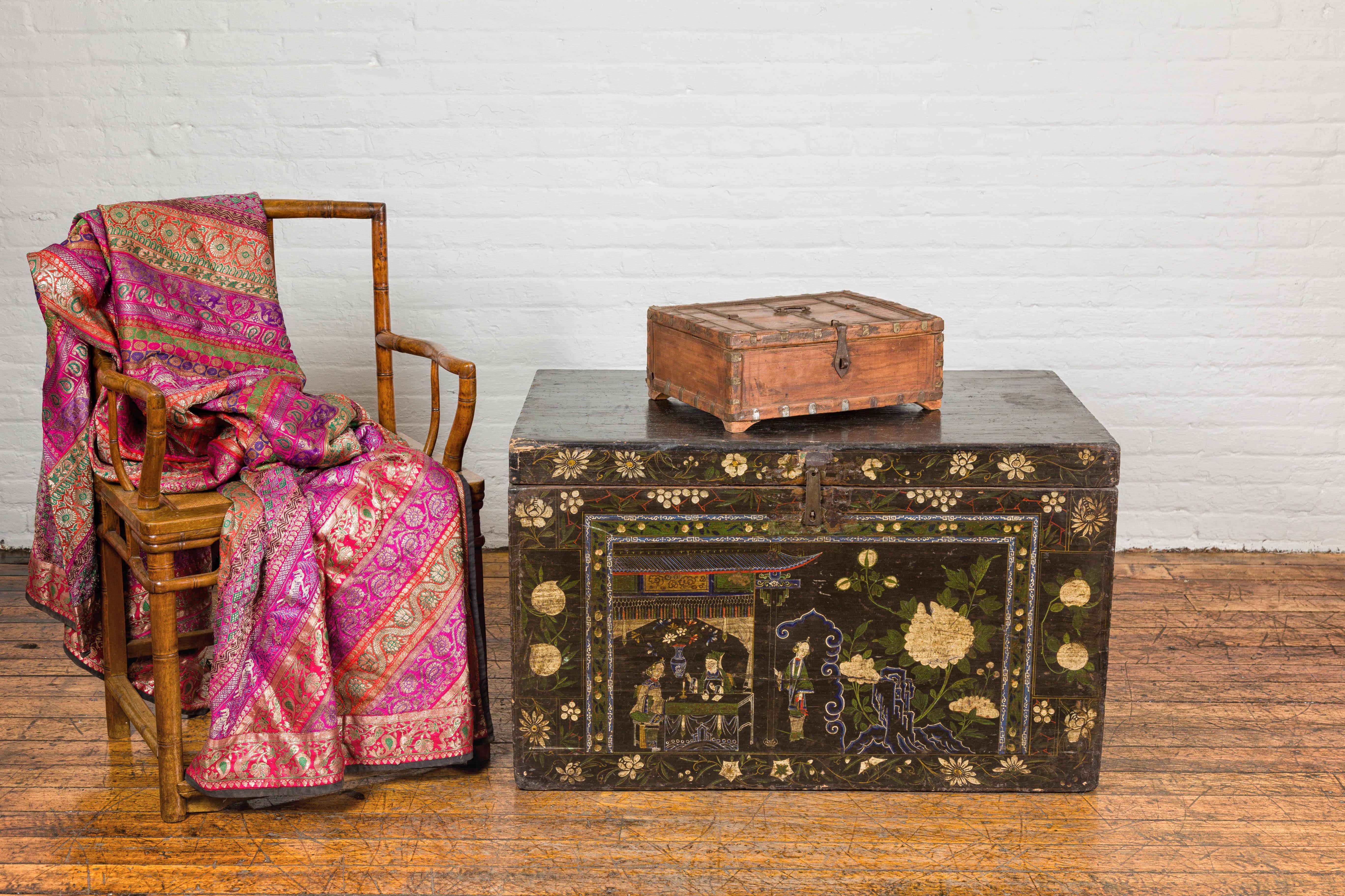 A rustic Indian wooden document box from the 19th century with brass details, partial opening top and petite bracket feet. This rustic Indian wooden document box from the 19th century exudes an aura of historical charm and authenticity. Adorned with