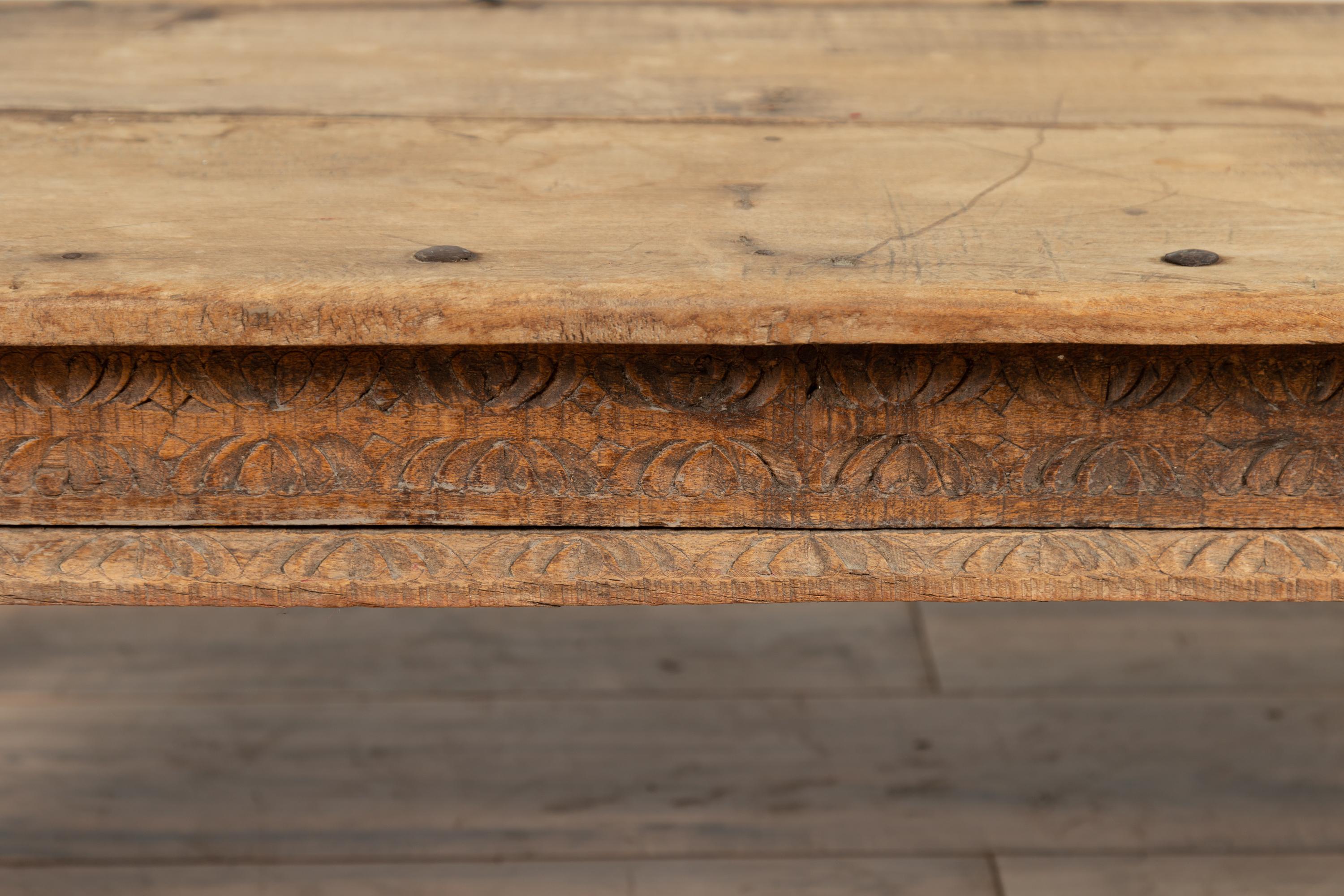 Rustic Indian Low Coffee Table with Carved Apron, Nailheads and Baluster Legs In Fair Condition In Yonkers, NY