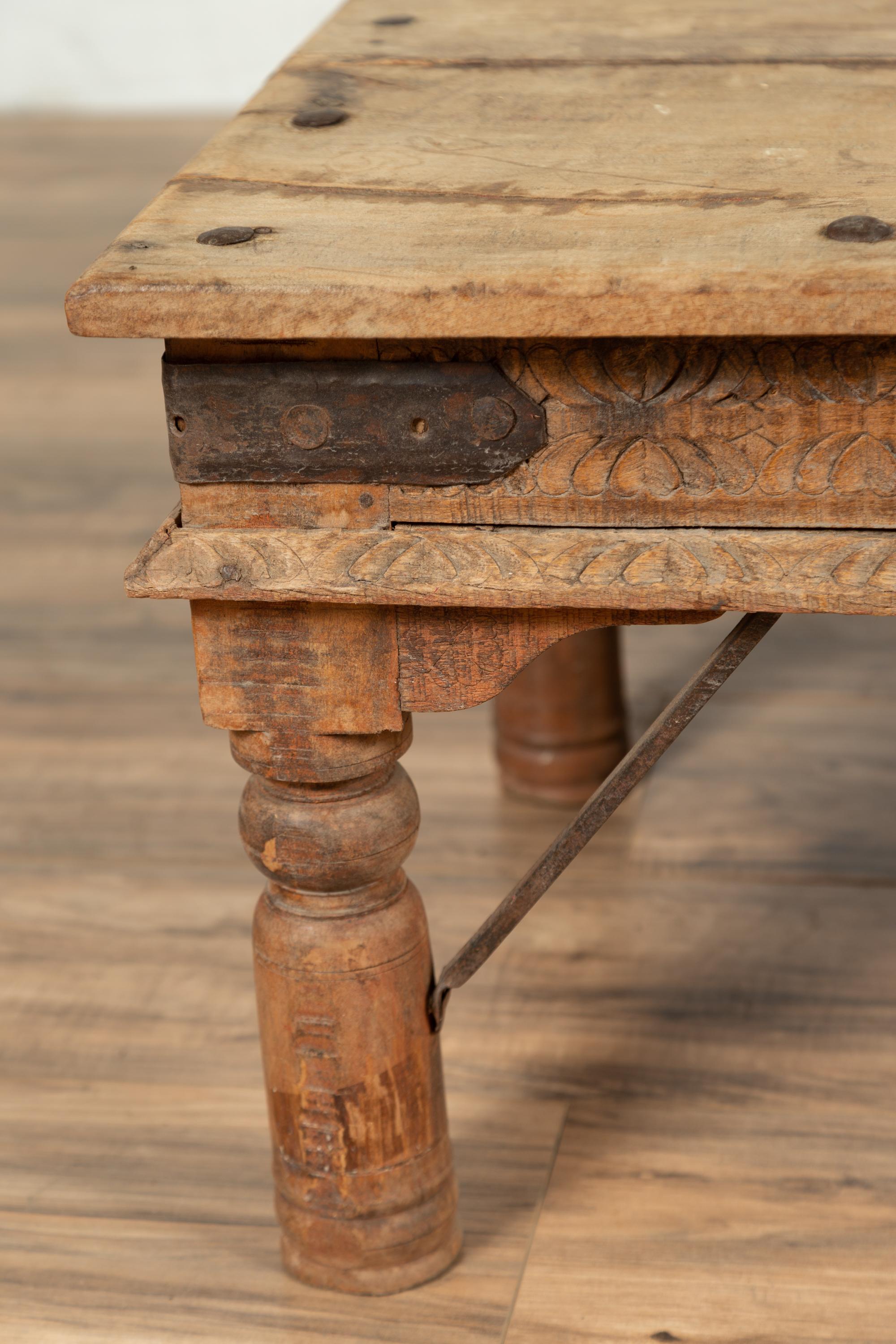 20th Century Rustic Indian Low Coffee Table with Carved Apron, Nailheads and Baluster Legs