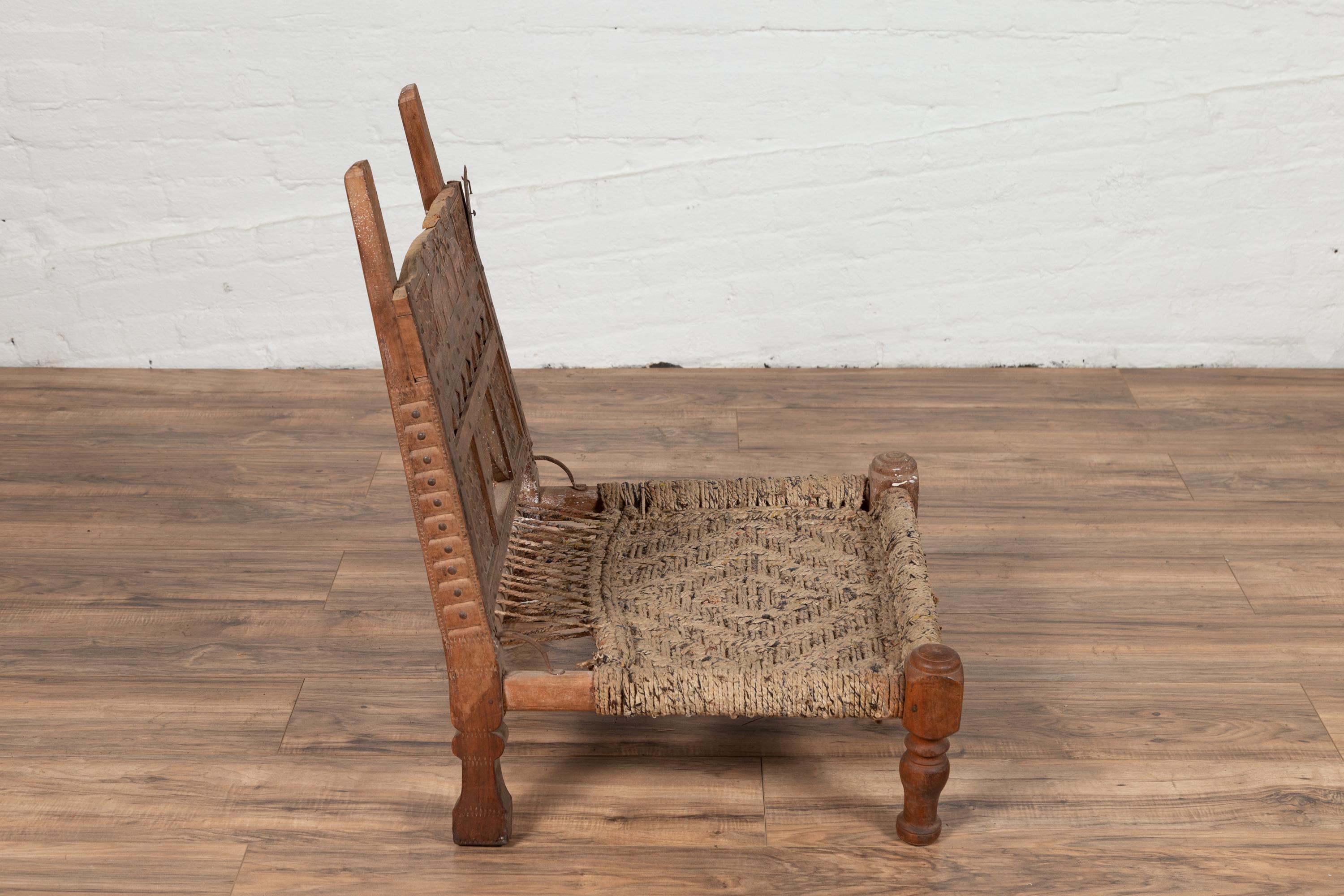 Rustic Indian Low Wooden Chair with Rope Seat and Weathered Appearance For Sale 2
